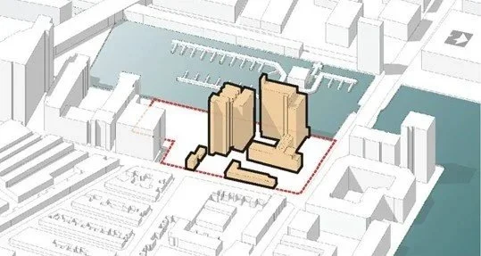 A 3D architectural model of a city block showing buildings, water, and parking areas, with a red boundary outline surrounding the site.