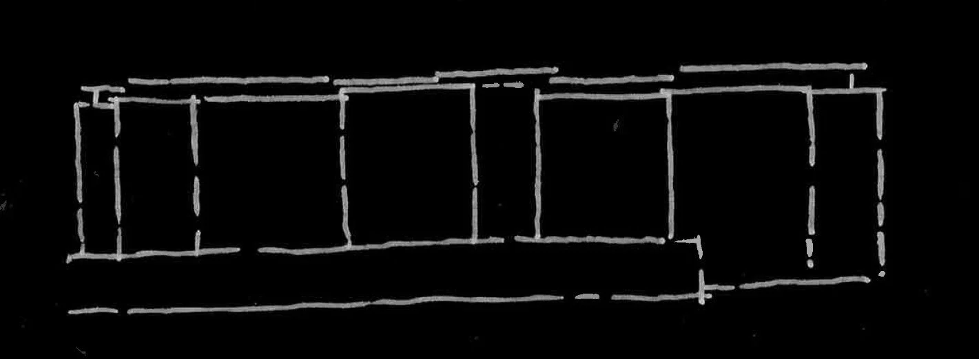White chalk outline of a rectangular, multi-room building on a black background, resembling a floor plan.