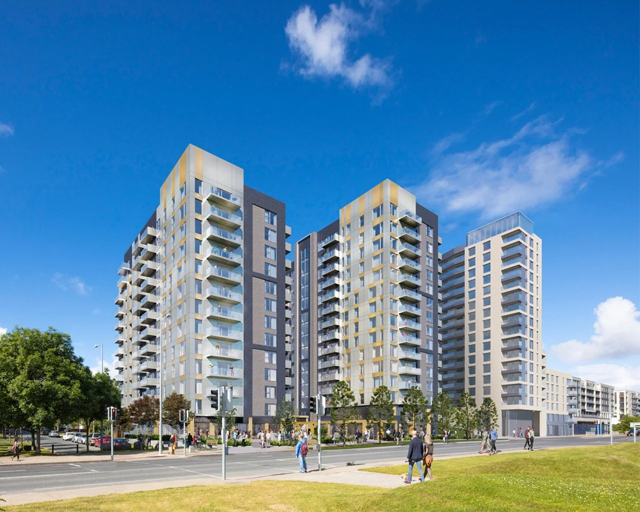 Modern multi-story apartment buildings with glass balconies under a blue sky, with people walking on the sidewalk and cars on the street in an urban setting.