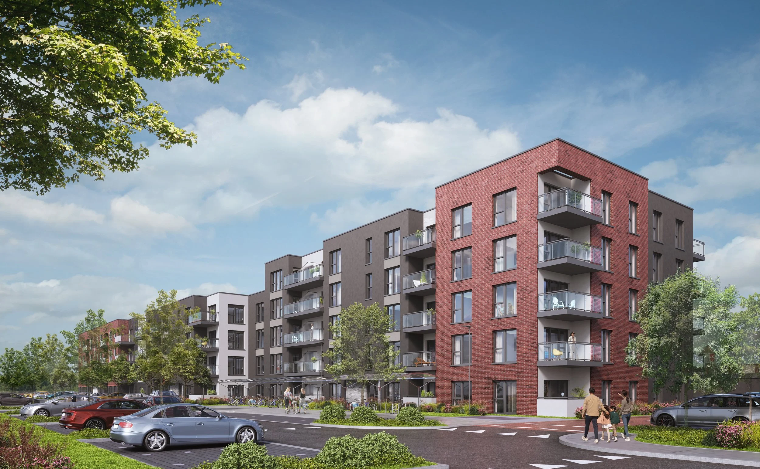 Modern multi-story apartment building with red and gray brick exterior, balconies with glass railings, surrounded by green trees, with cars parked in front and people walking and biking.