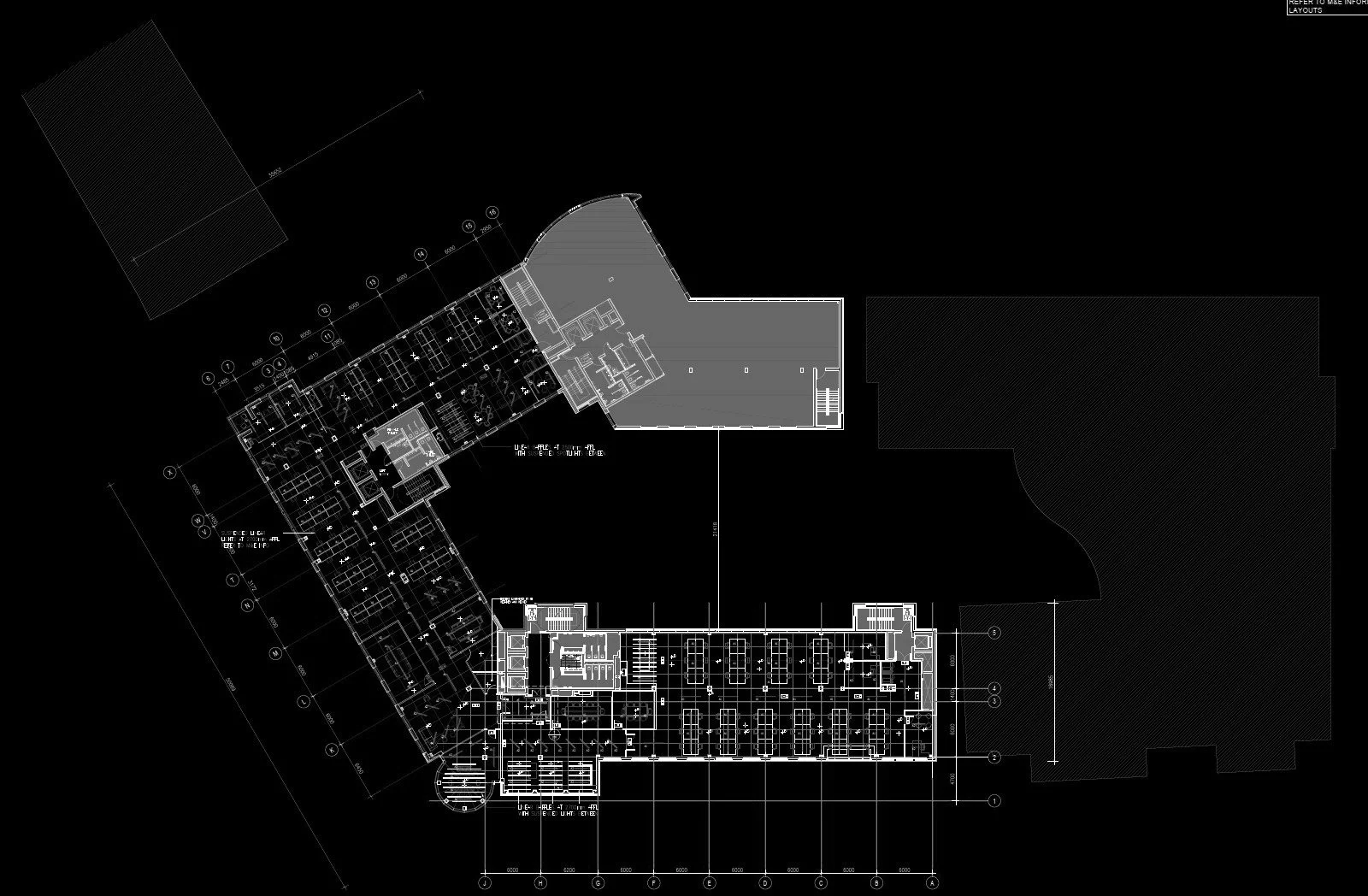 Architectural blueprint showing a floor plan of a building with multiple rooms and sections on a black background.