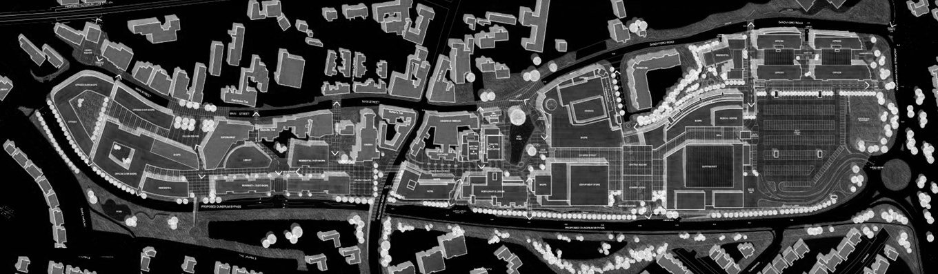 A black and white architectural site plan of an urban area showing various building layouts, roads, parking lots, and green spaces.