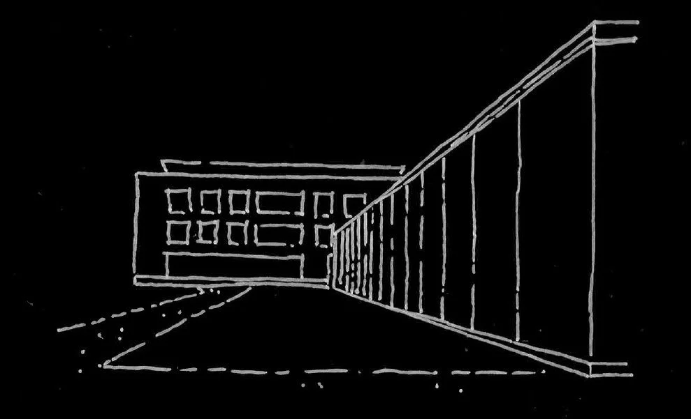A line drawing of a modern building with several square windows on the upper part and vertical panels on the side, viewed from a driveway or street with dashed lines.