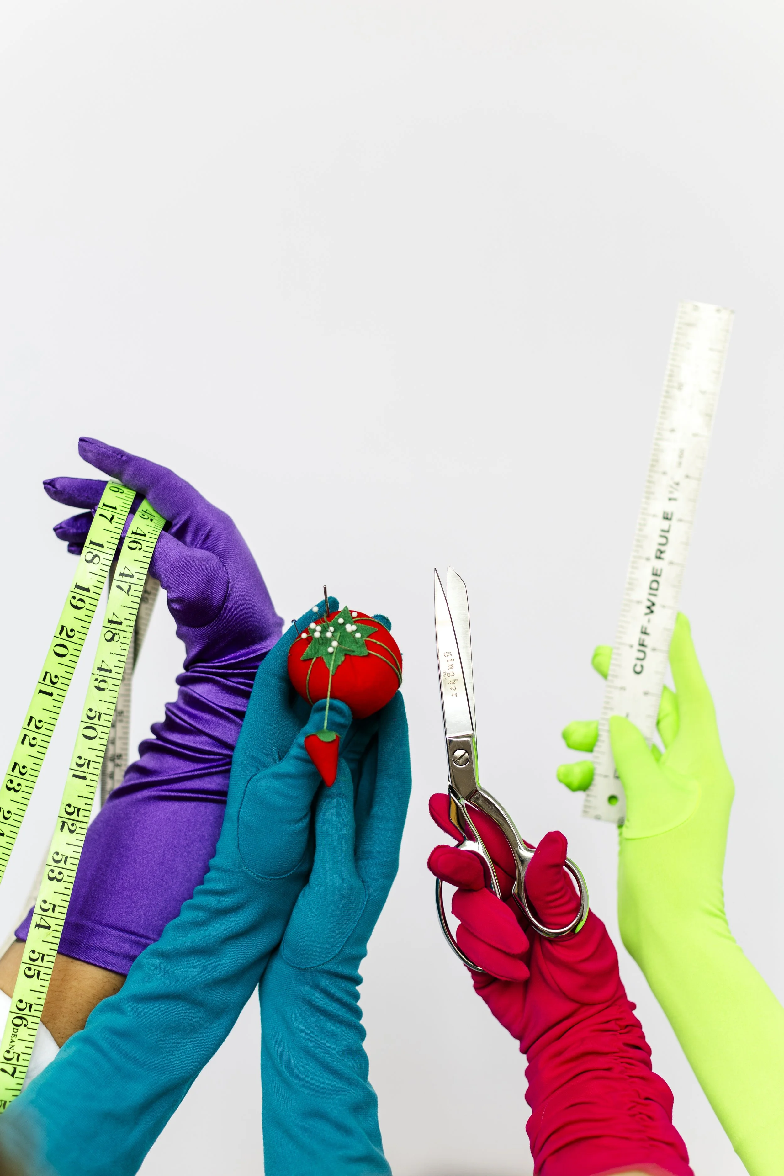 brand photography for ensemble, sewing tools being held up by gloved hands augusta georgia