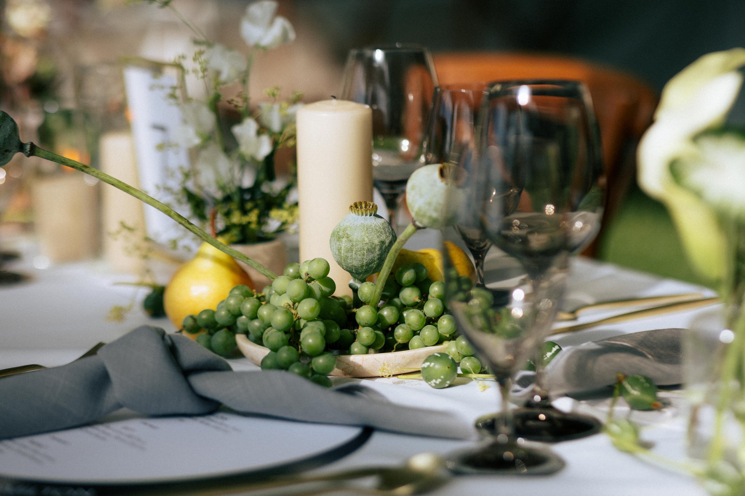 Modern floral tablescape featuring fruits floral design, curated by a Toronto floral designer