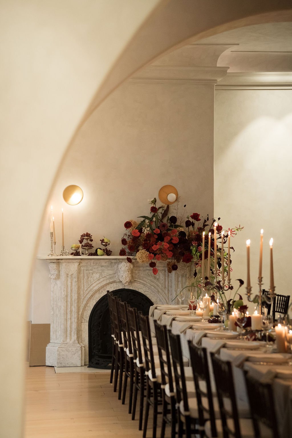 "A moody, modern take on an intimate wedding—candelabras glowing among soft florals by niagara, cambridge wedding florist"