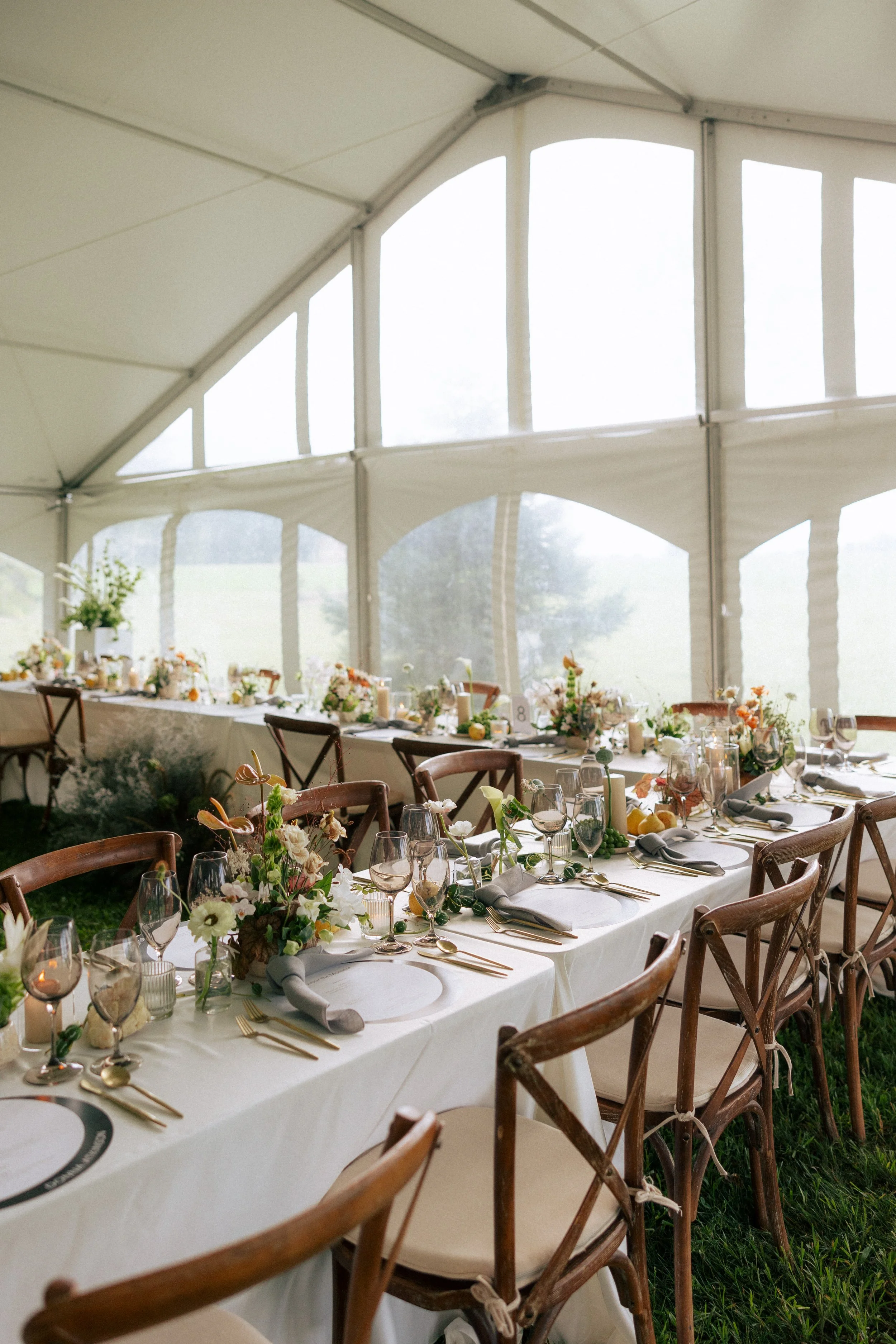 Romantic wedding reception with modern floral centerpieces, candlelight, and curated tablescape by a Toronto wedding florist