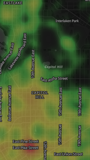 Heat map showing rainfall intensity in Capitol Hill, Seattle, with streets labeled such as East Pine Street, East Union Street, and 15th Avenue East. Green areas indicate lighter rain, while yellow areas indicate heavier rain.