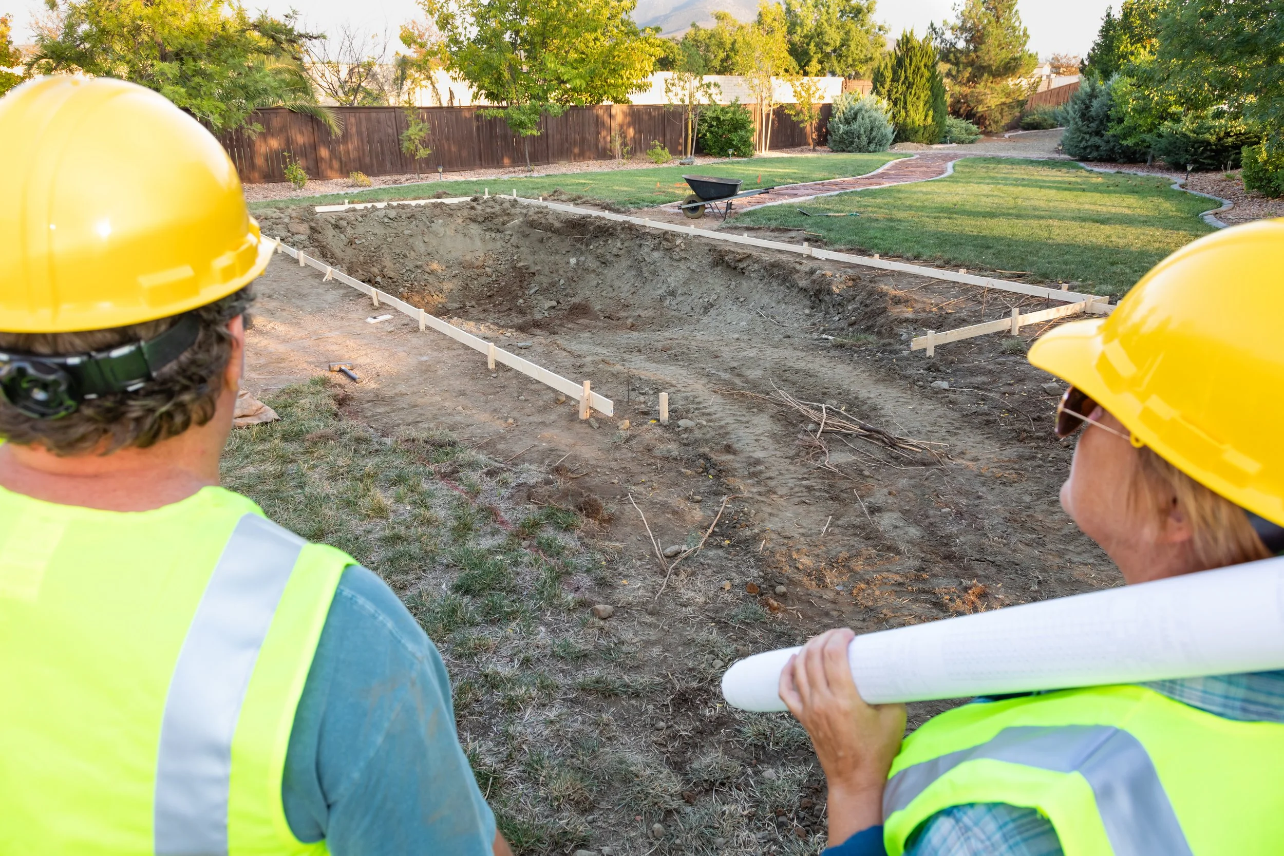 Male and Female Workers Overlooking Pool Sept 11 2024.jpg