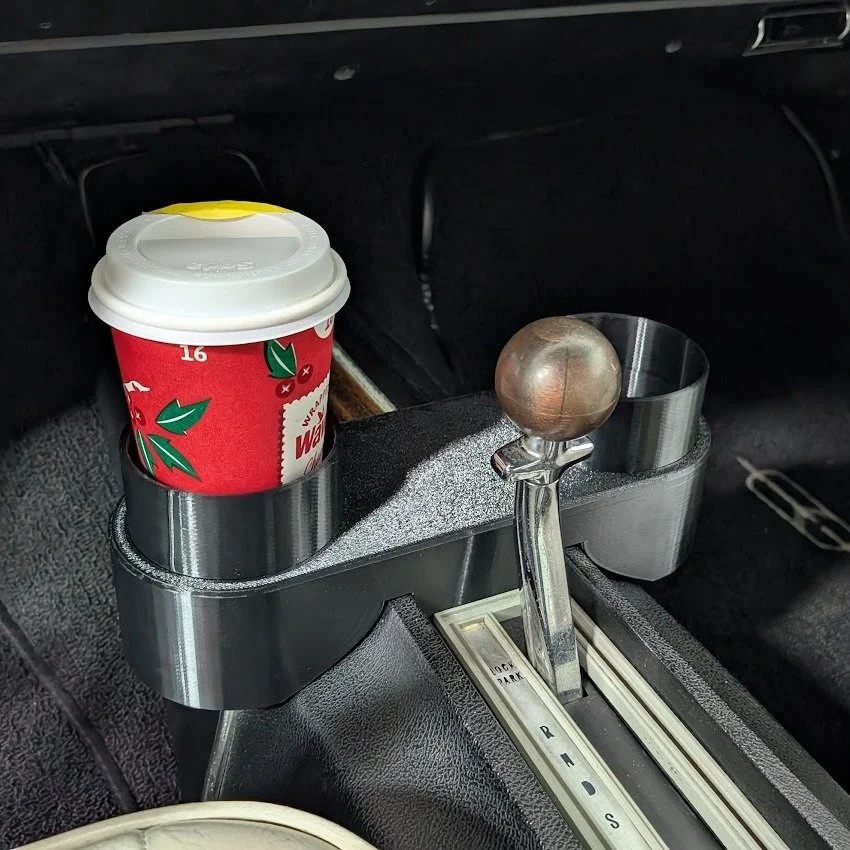 Customer wanted a simple cupholder that could be quickly removed for his Oldsmobile Cutlass. Uses grippy pads to tightly hold itself into the groove of the center console, and TPU bumpers inside the cups to keep drinks tight. 

#3dprinting #oldsmobil