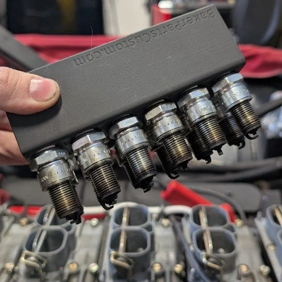 Spark plug holders with integrated grips to hold most standard sized plugs. Allows for easier inspection/comparison of plugs. Originally made due to the lack of V12 plug holders. Available in matte black and green on my site, link in bio.

#sparkplug
