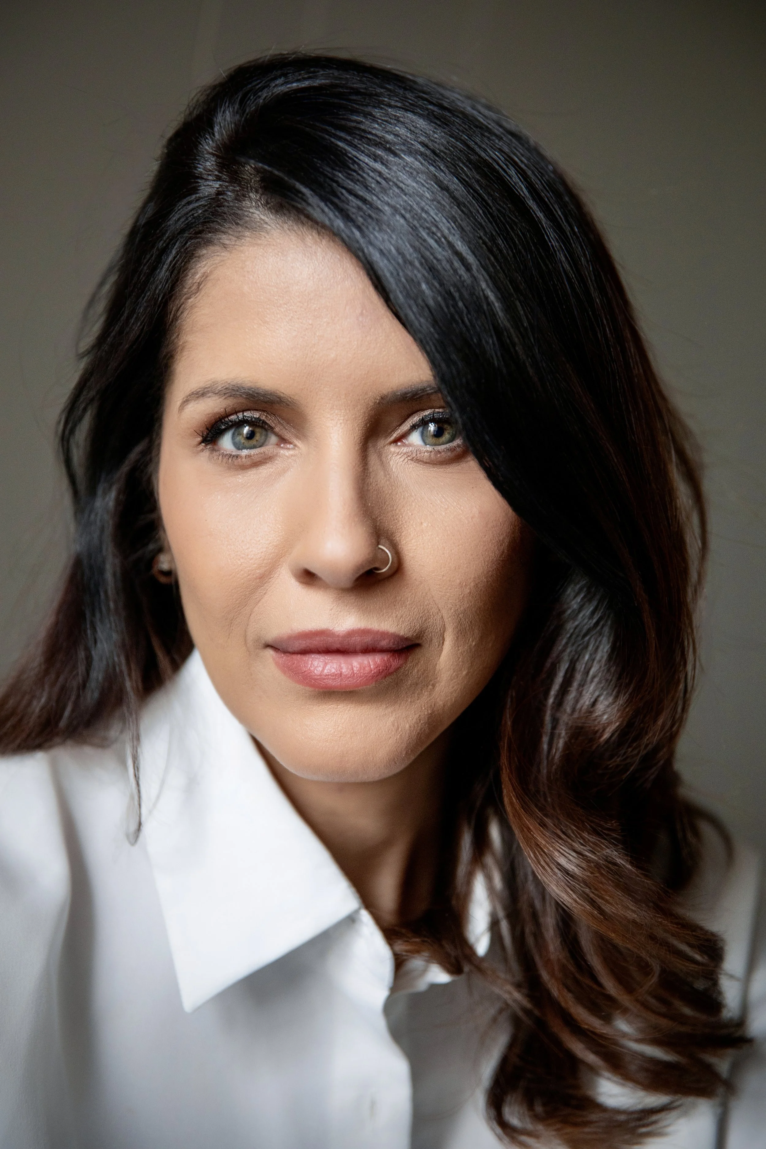 Professional headshot with a relaxed, genuine expression, example of authentic personal branding photography in NYC