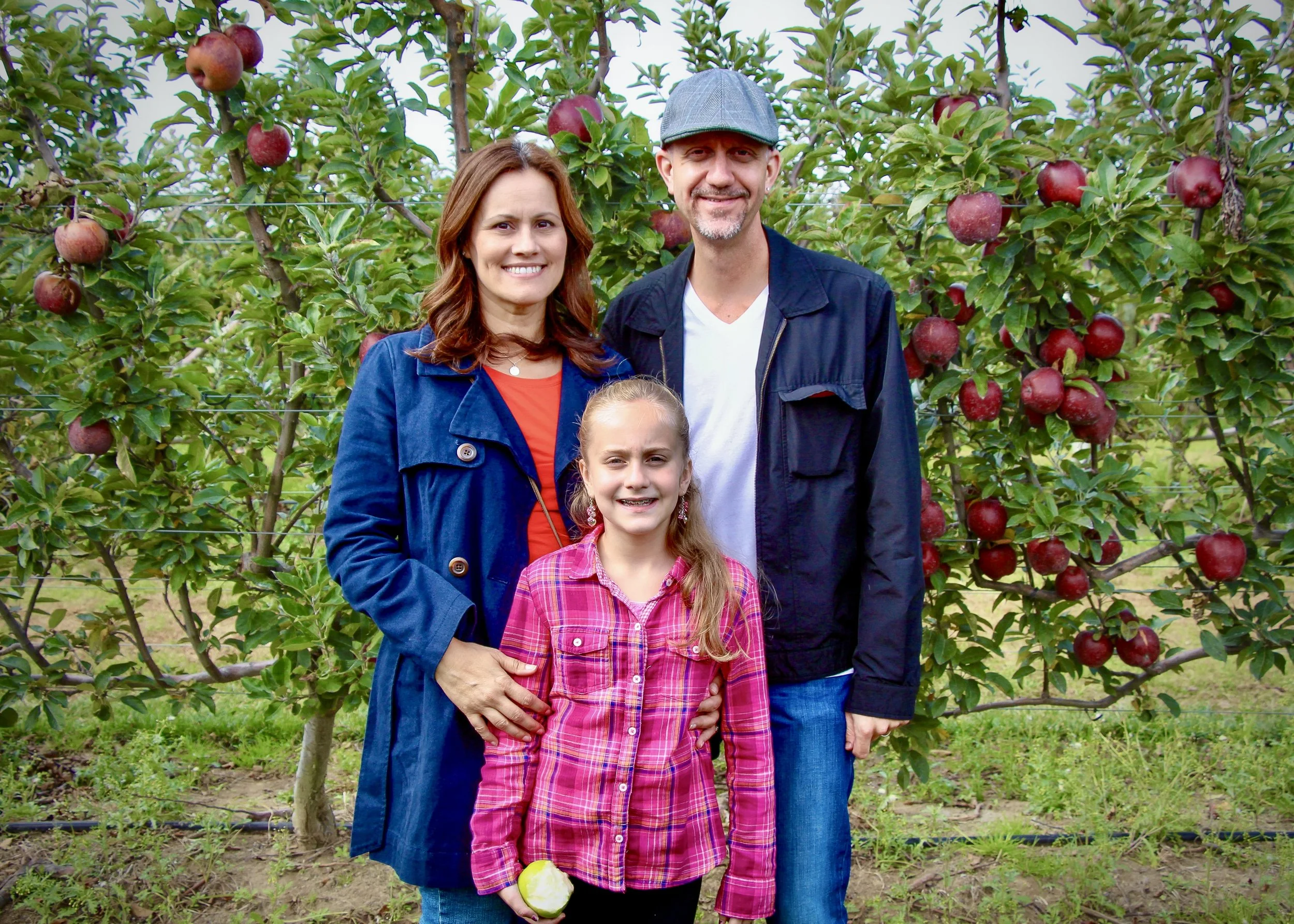 Sean Broedow with his family at an apple orchard, a personal example of authentic family photography