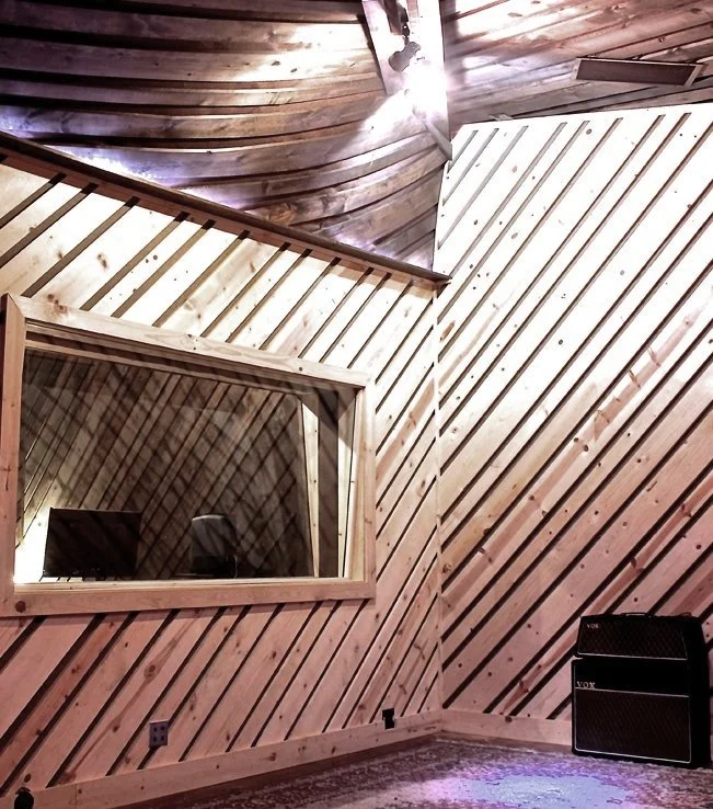 Ceiling detail — timber run on the diagonal, built rather than converted.