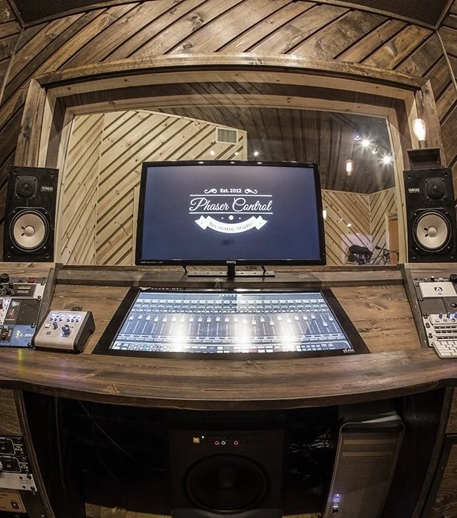 The control room wide, with the upright piano at the left.