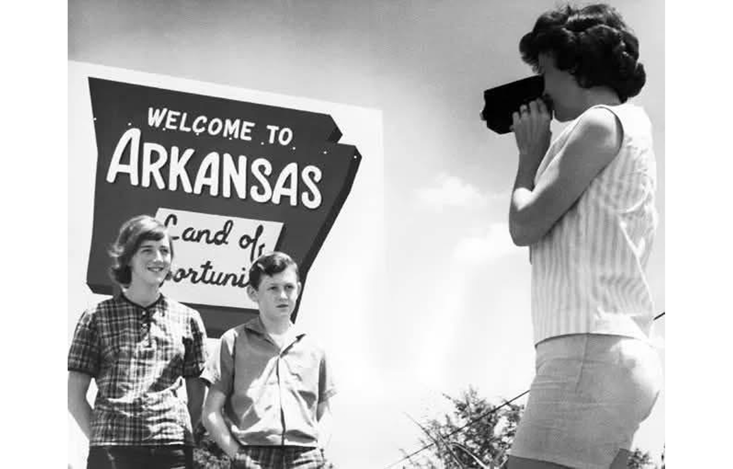 "Welcome to Arkansas" road sign showing old state slogan; circa 1960