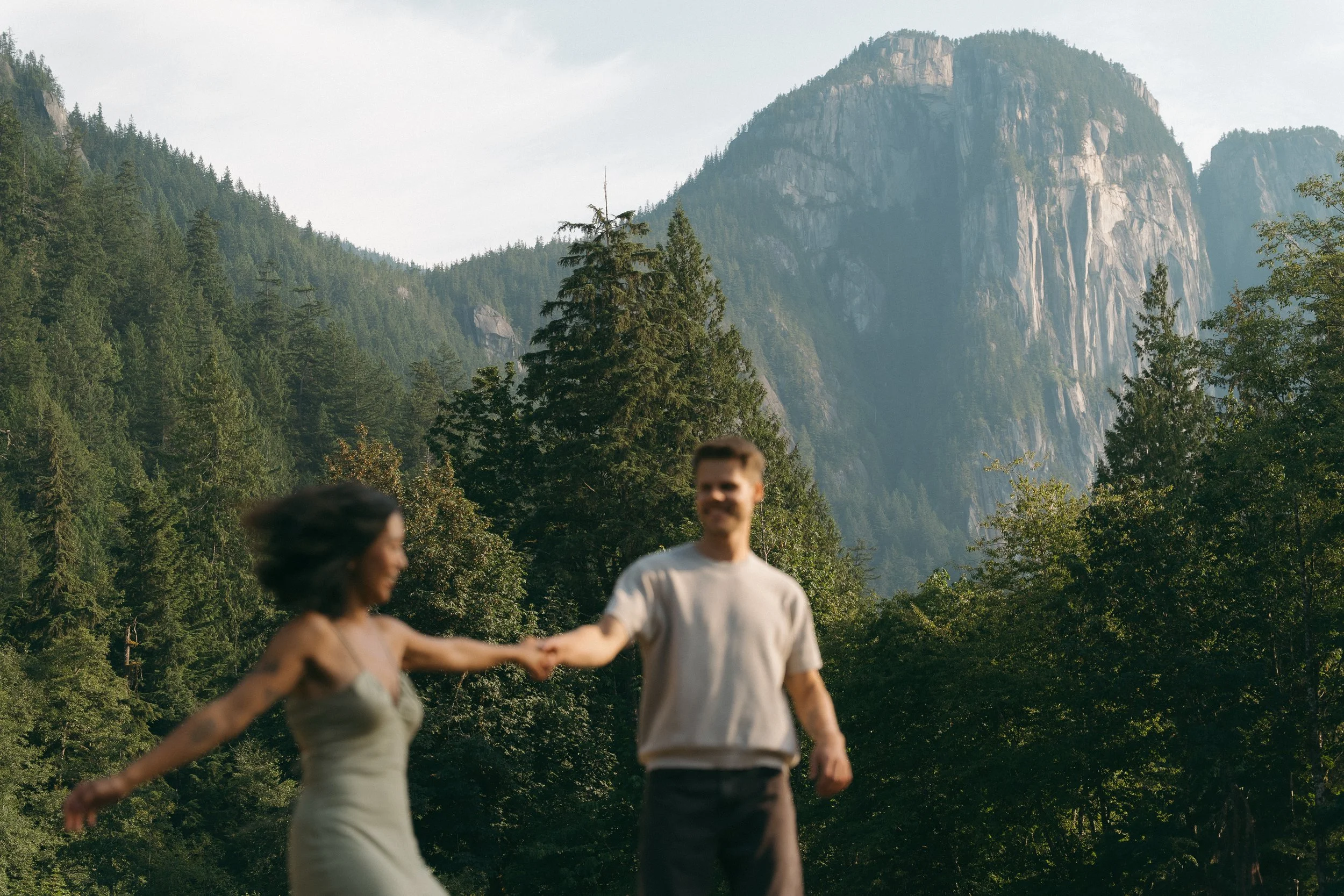 couples golden hour engagement session in the mountains and a field in Squamish BC