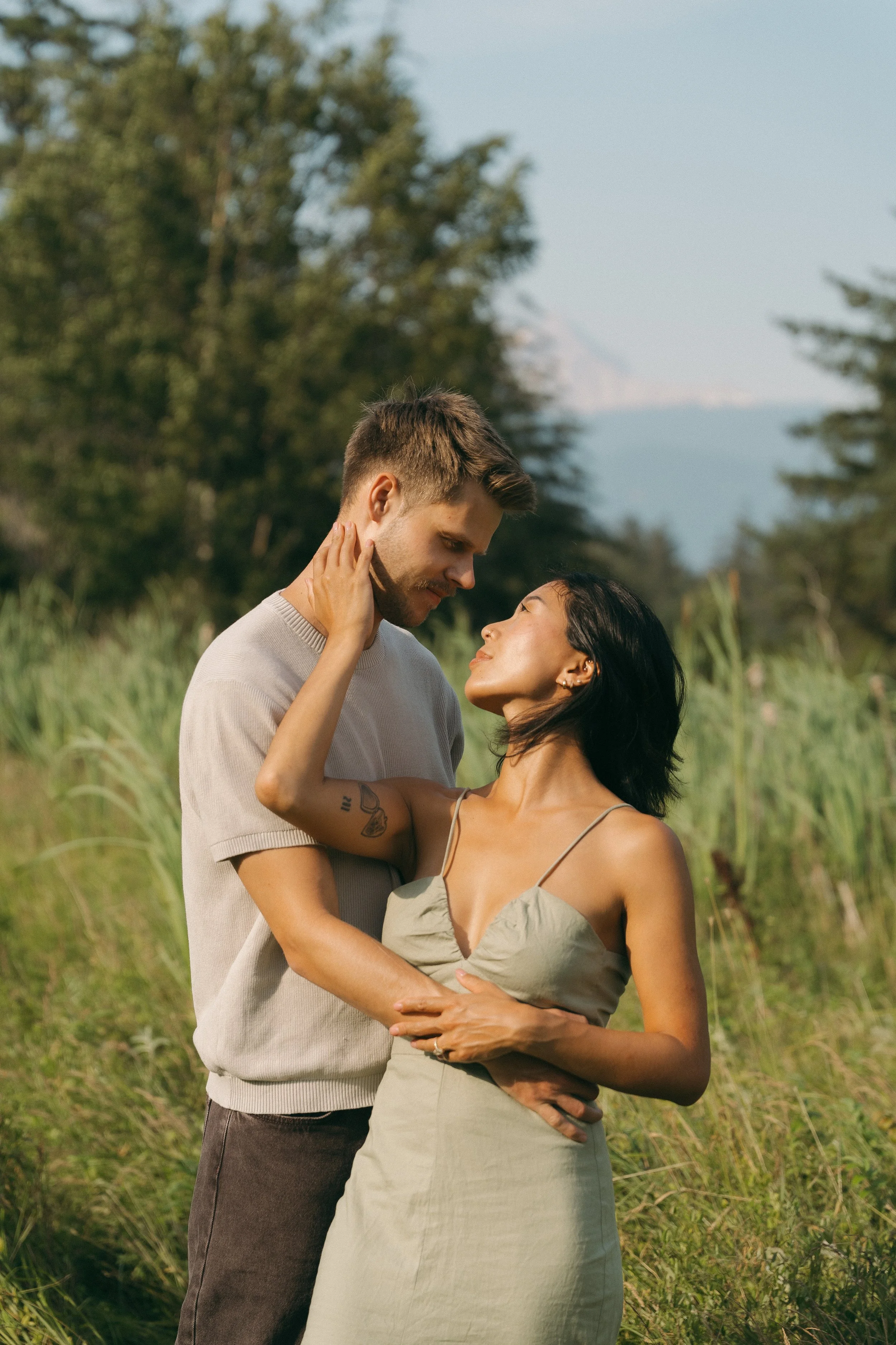 couples golden hour engagement session in a field in Squamish BC