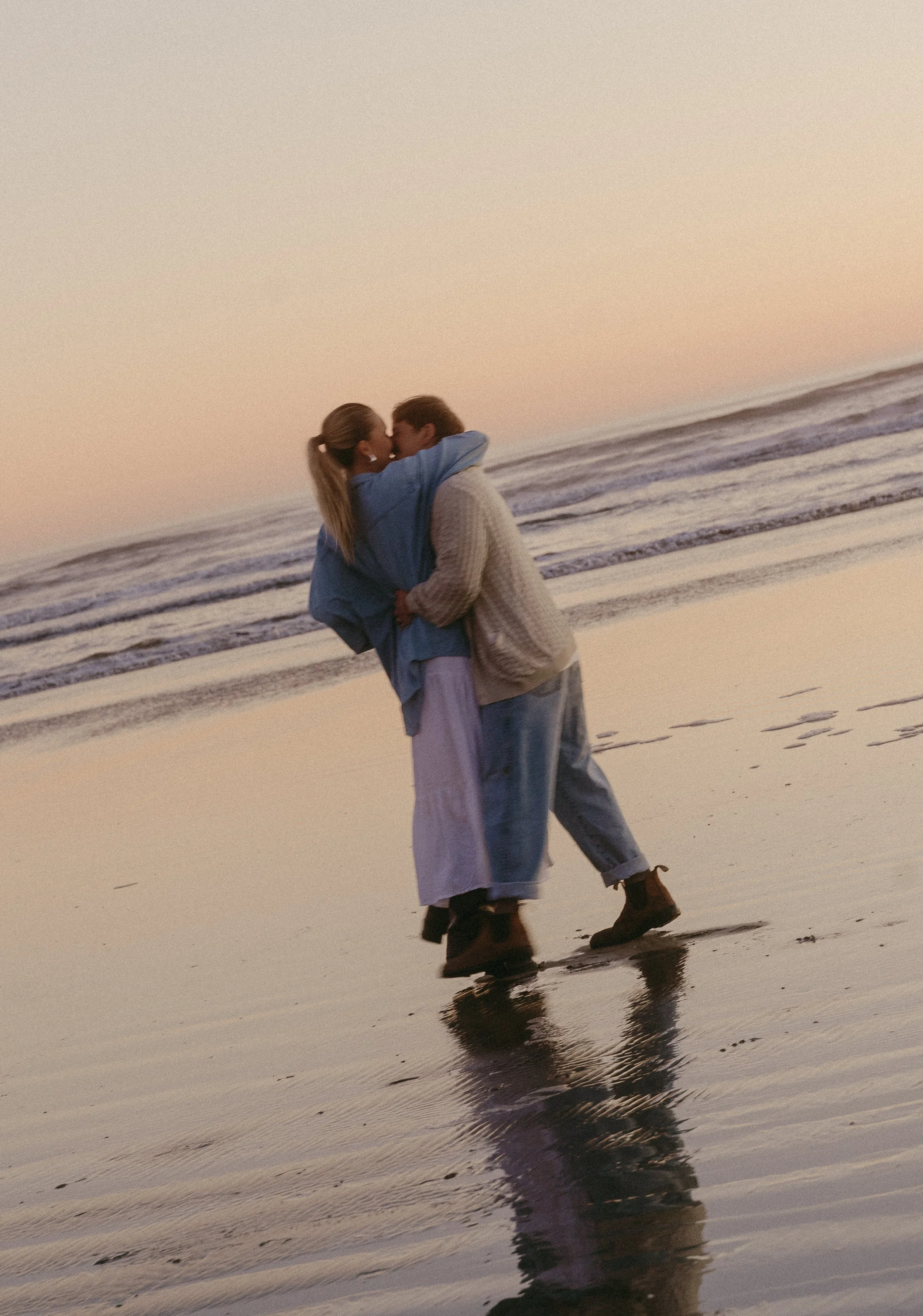 Couples session on the beach at golden hour in Tofino BC