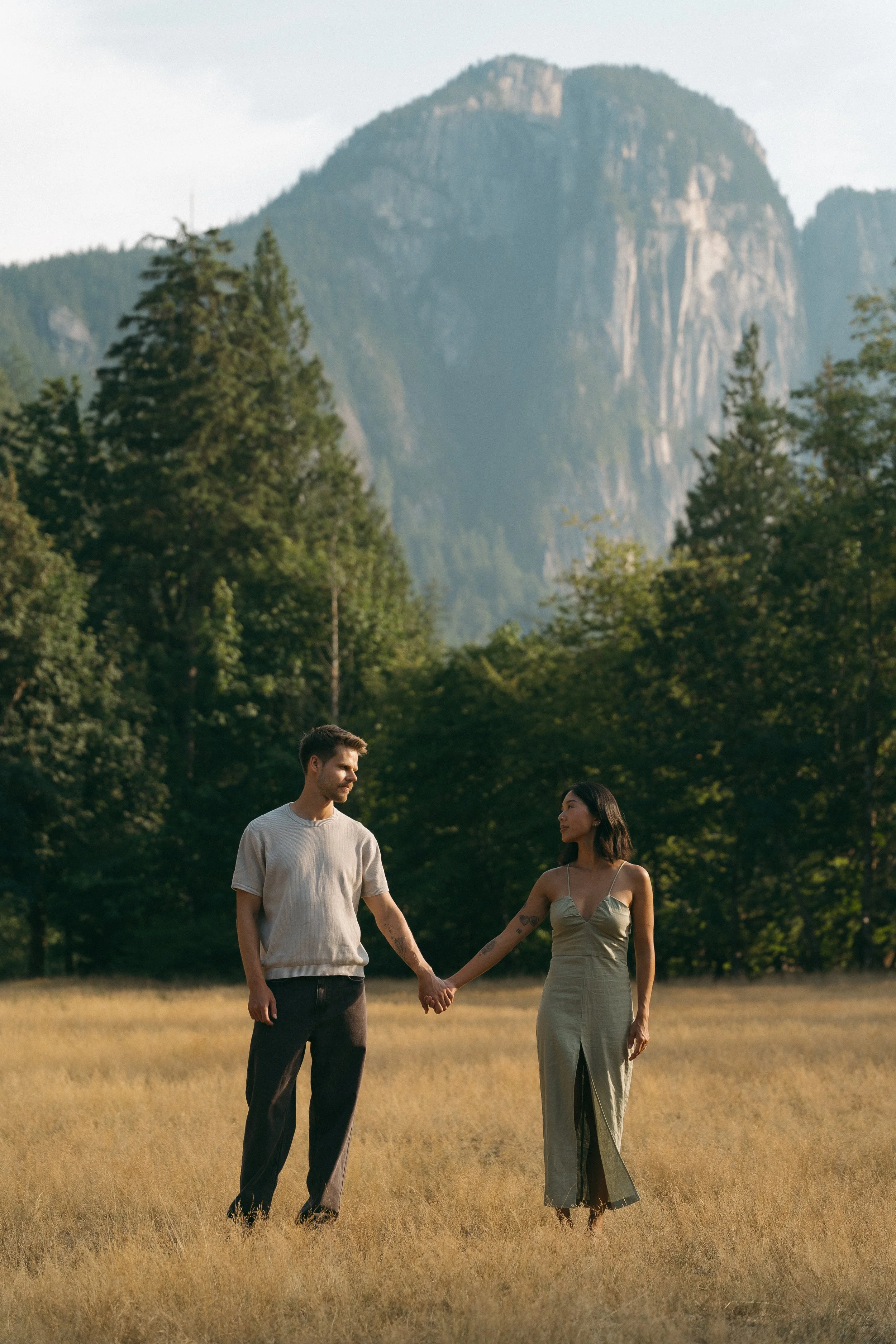 couples golden hour engagement session in the mountains and a field in Squamish BC