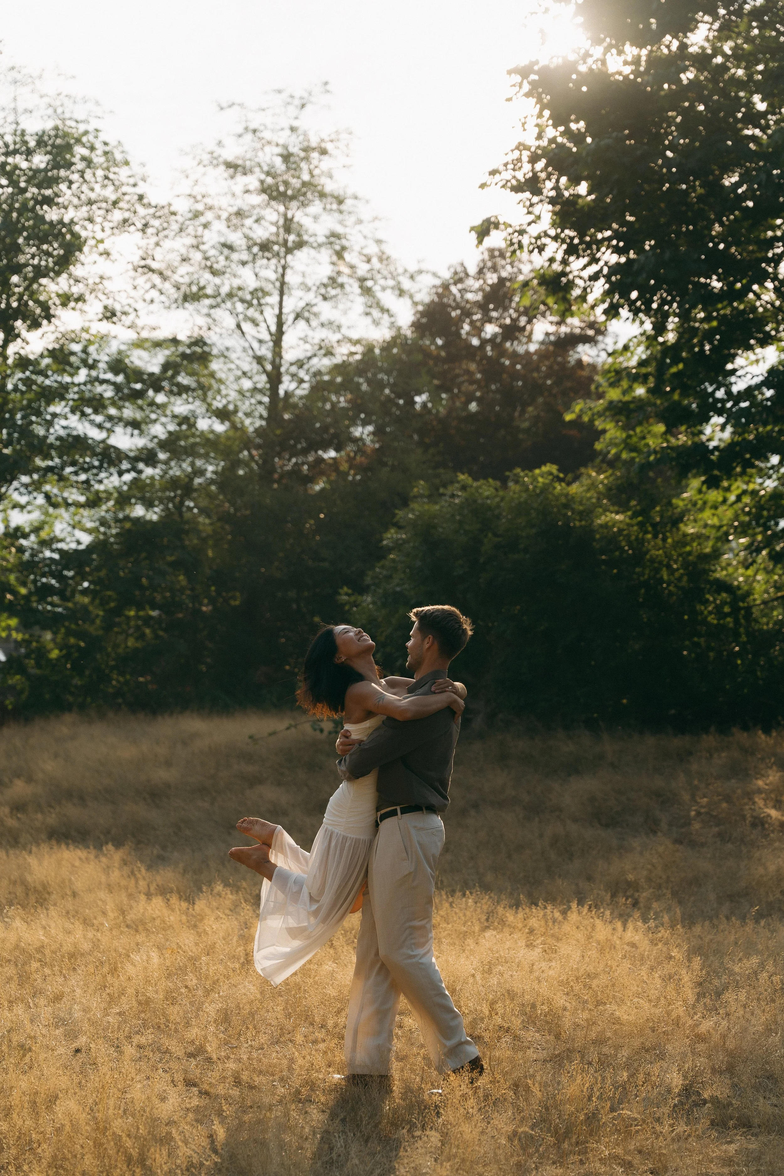 couples golden hour engagement session in the mountains and a field in Squamish BC