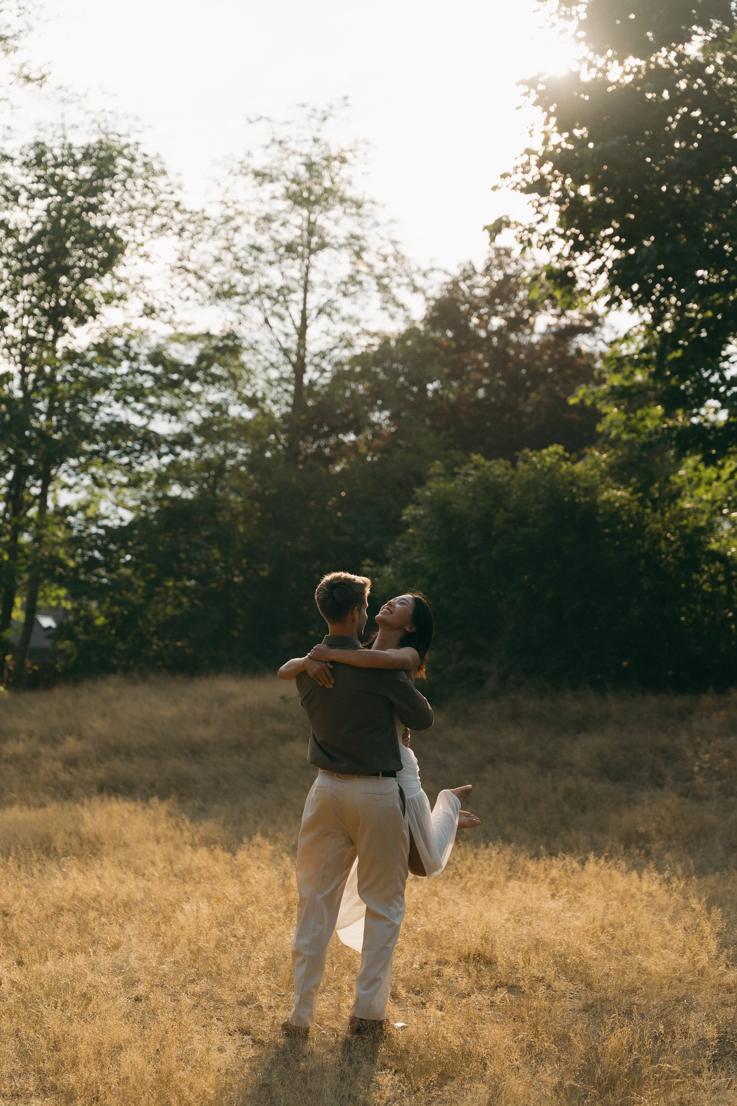 couples golden hour engagement session in the mountains and a field in Squamish BC