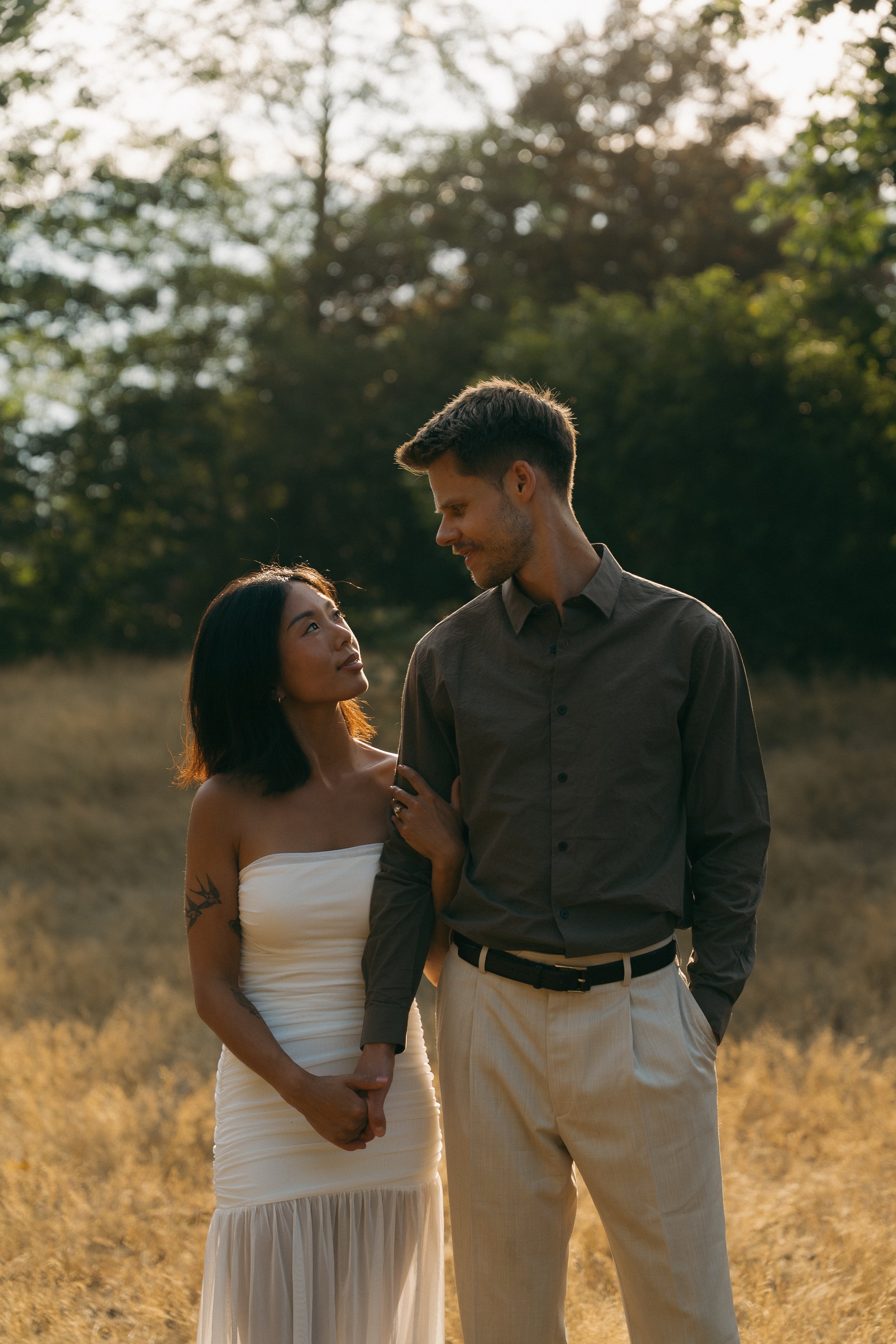 couples golden hour engagement session in the mountains and a field in Squamish BC