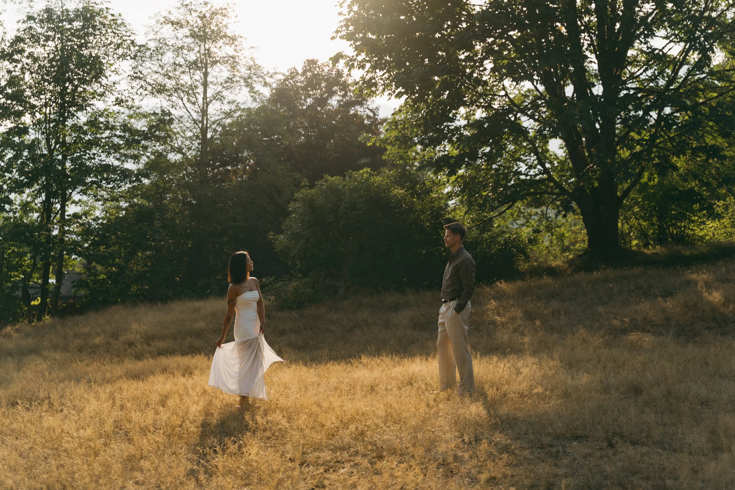 couples golden hour engagement session in the mountains and a field in Squamish BC