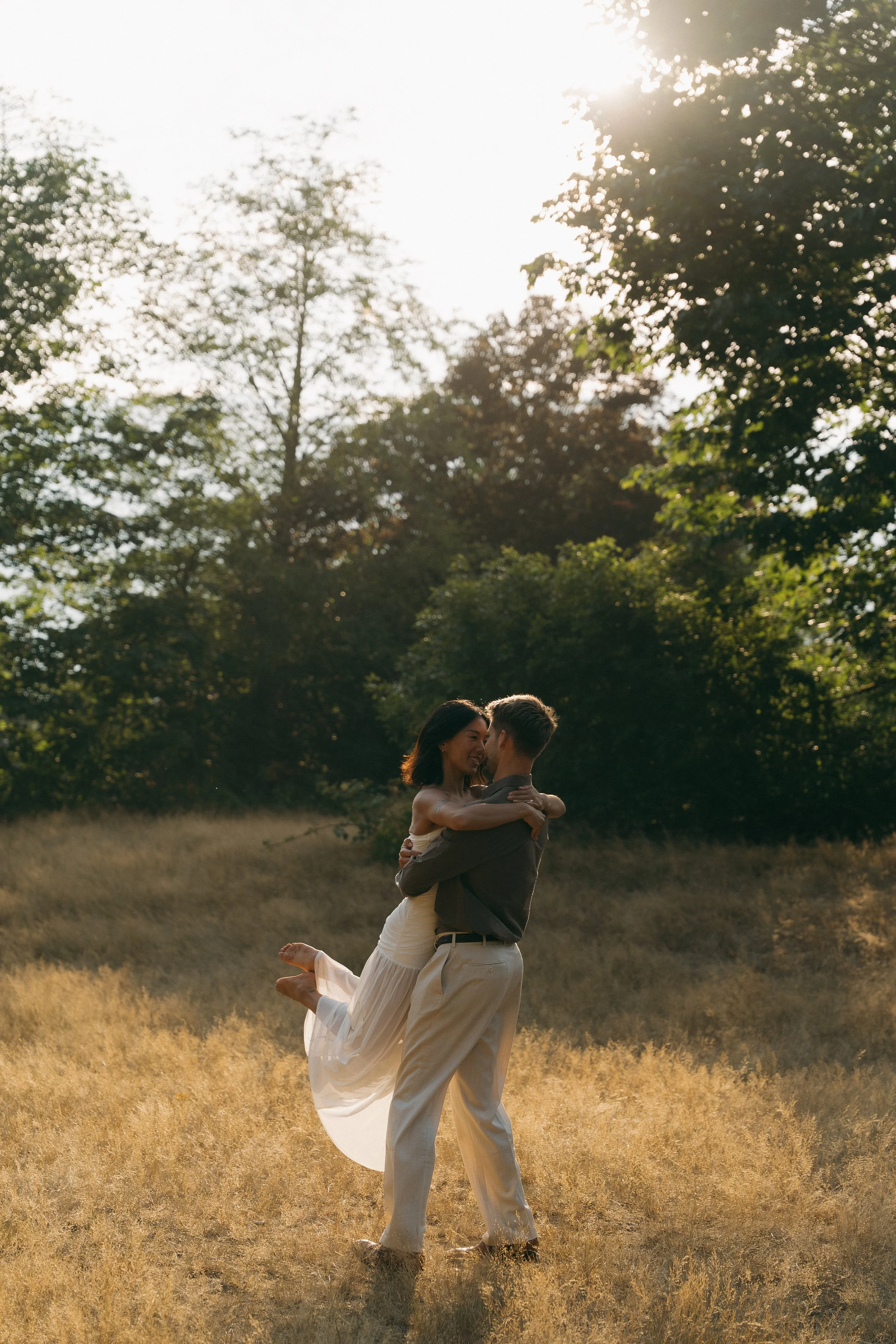 couples golden hour engagement session in a field in Squamish BC
