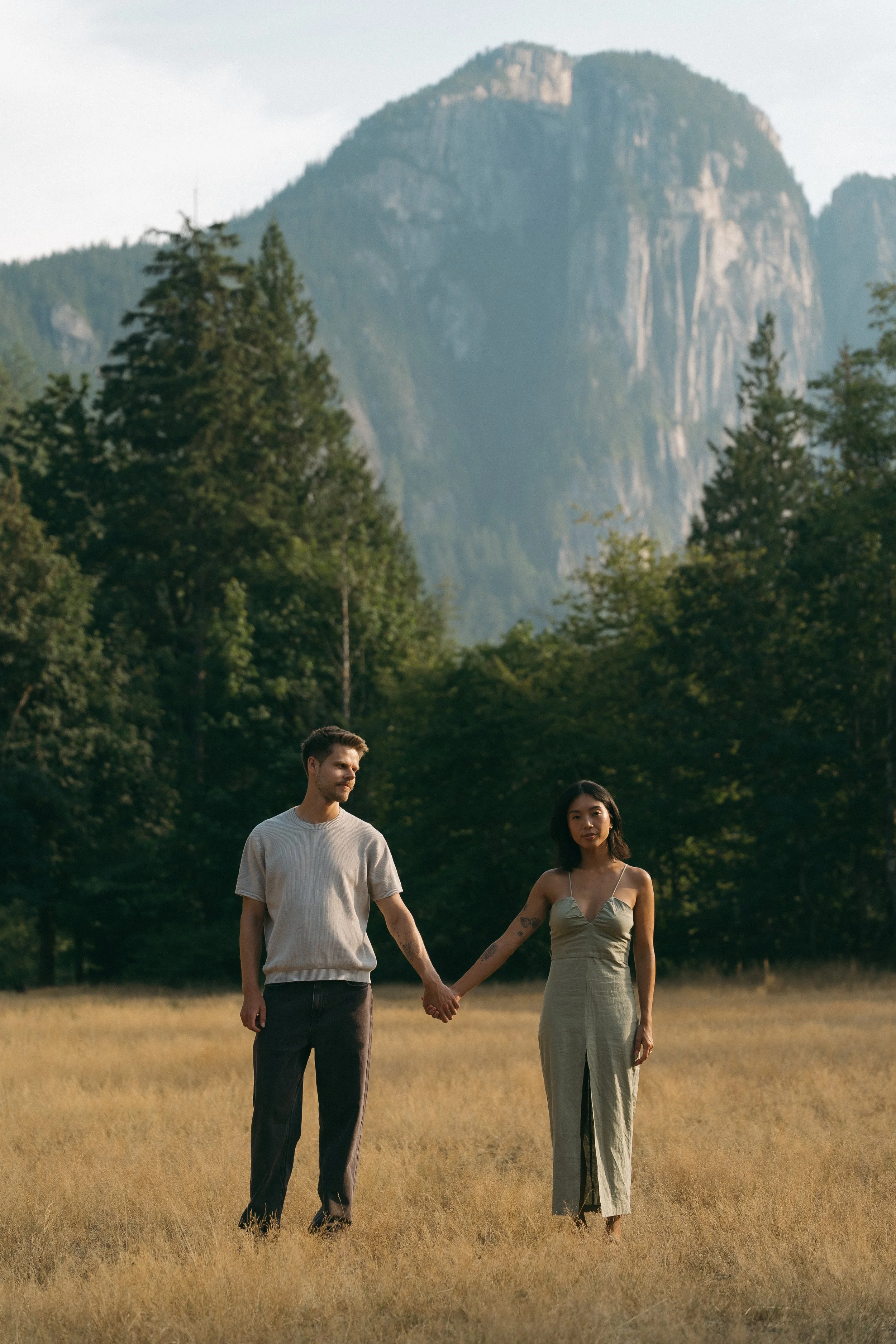 couples golden hour engagement session in the mountains and a field in Squamish BC