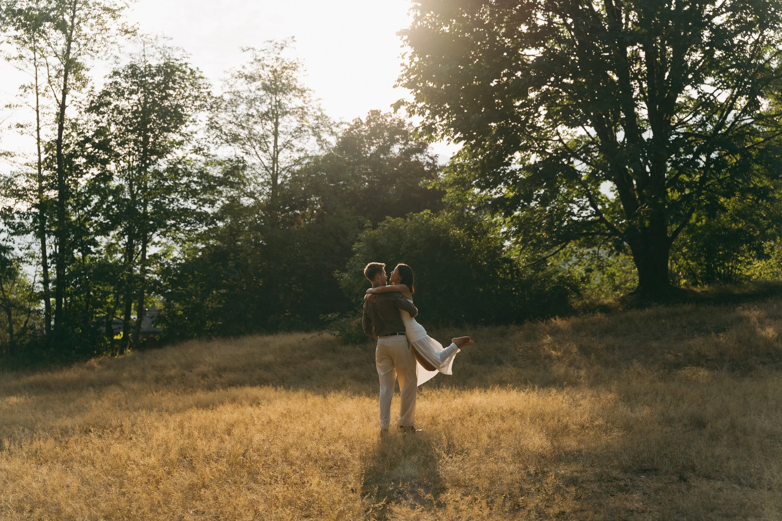 couples golden hour engagement session in the mountains and a field in Squamish BC