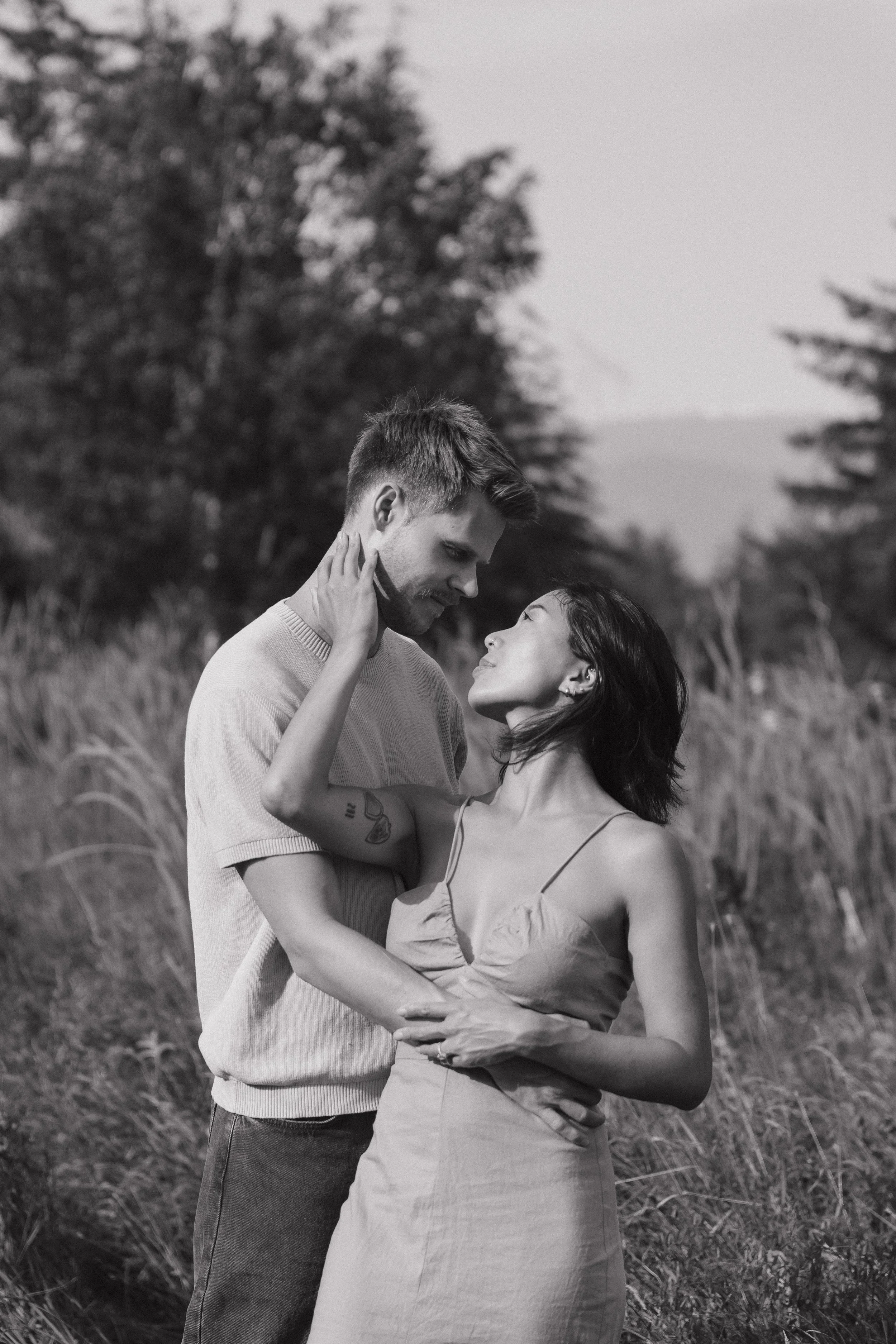 couples golden hour engagement session in a field in Squamish BC