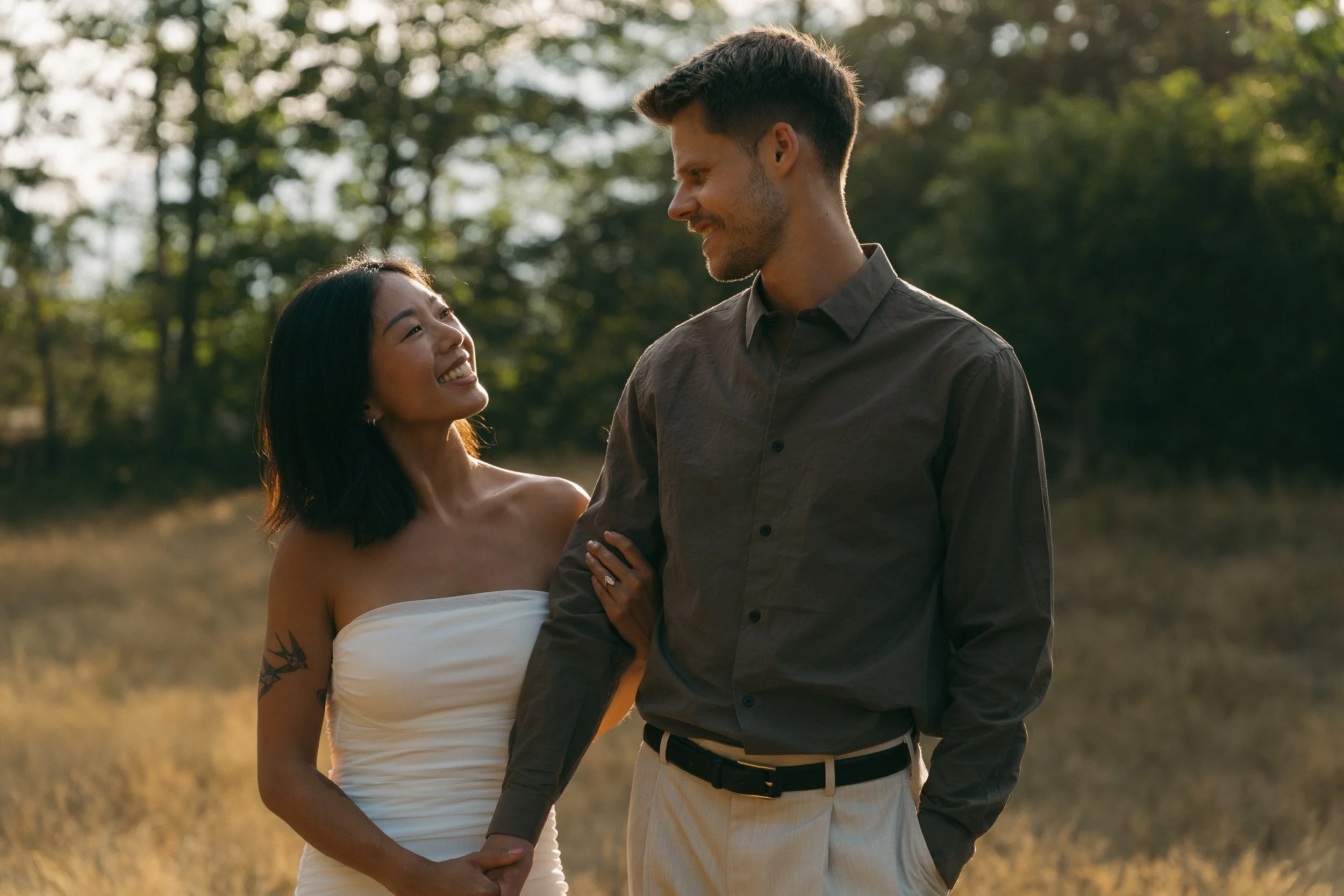 couples golden hour engagement session in the mountains and a field in Squamish BC