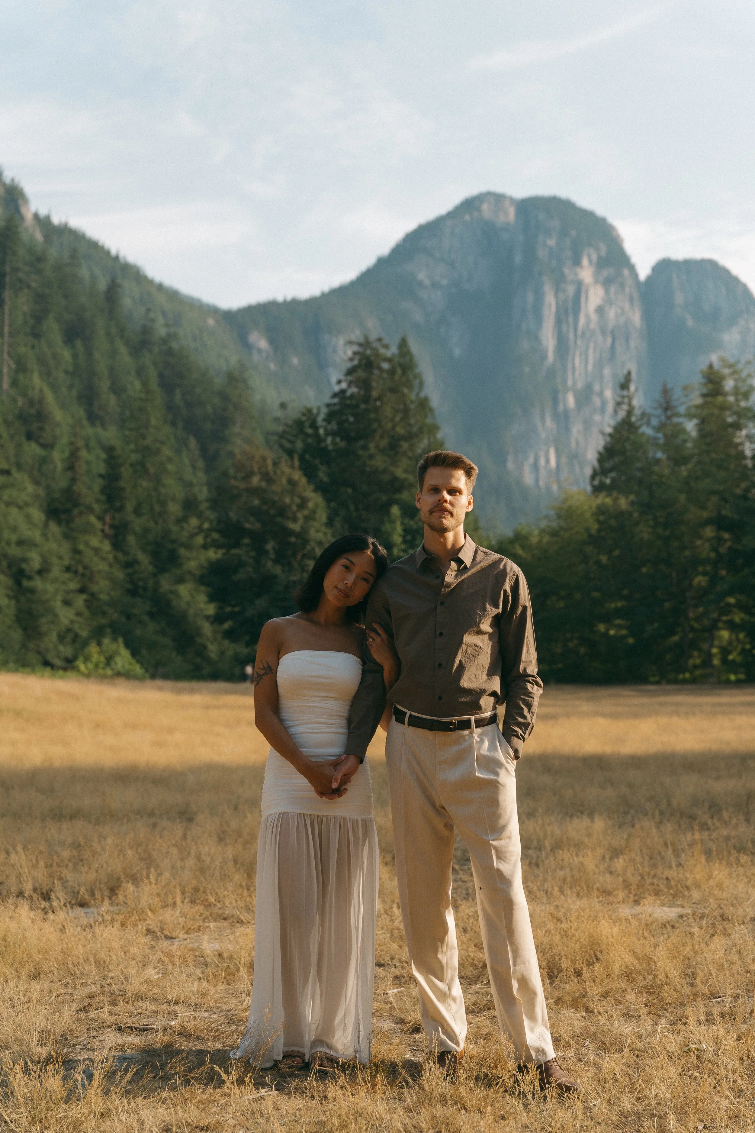 couples golden hour engagement session in the mountains and a field in Squamish BC