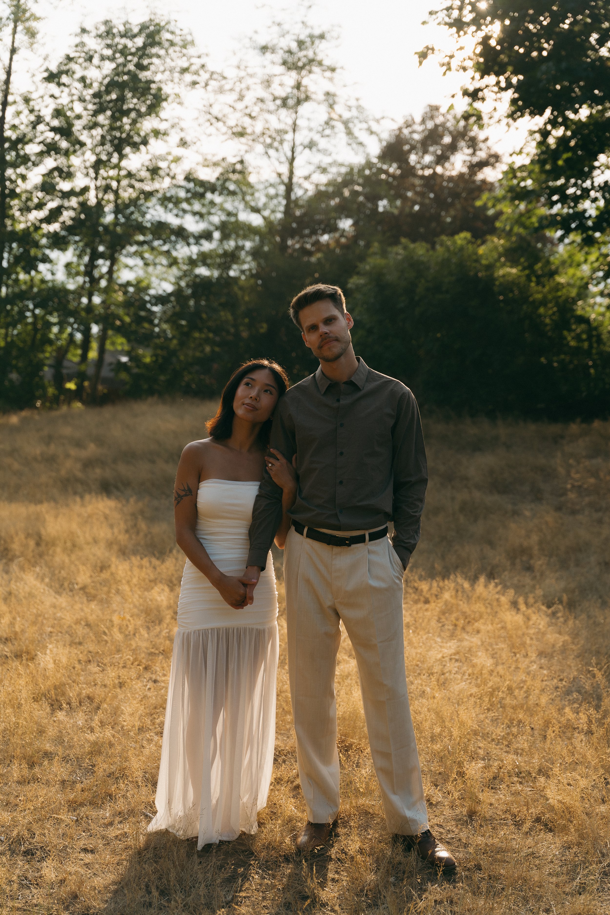 couples golden hour engagement session in the mountains and a field in Squamish BC