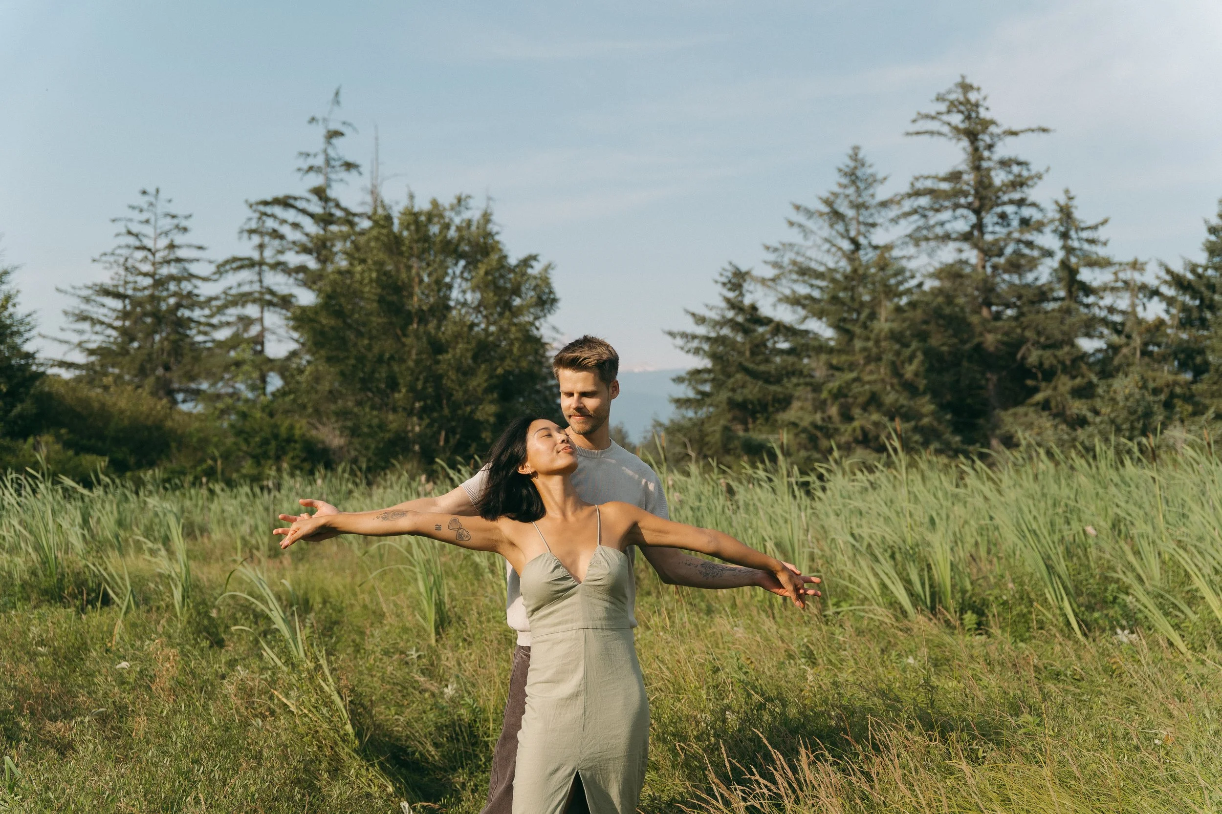 couples golden hour engagement session in a field in Squamish BC