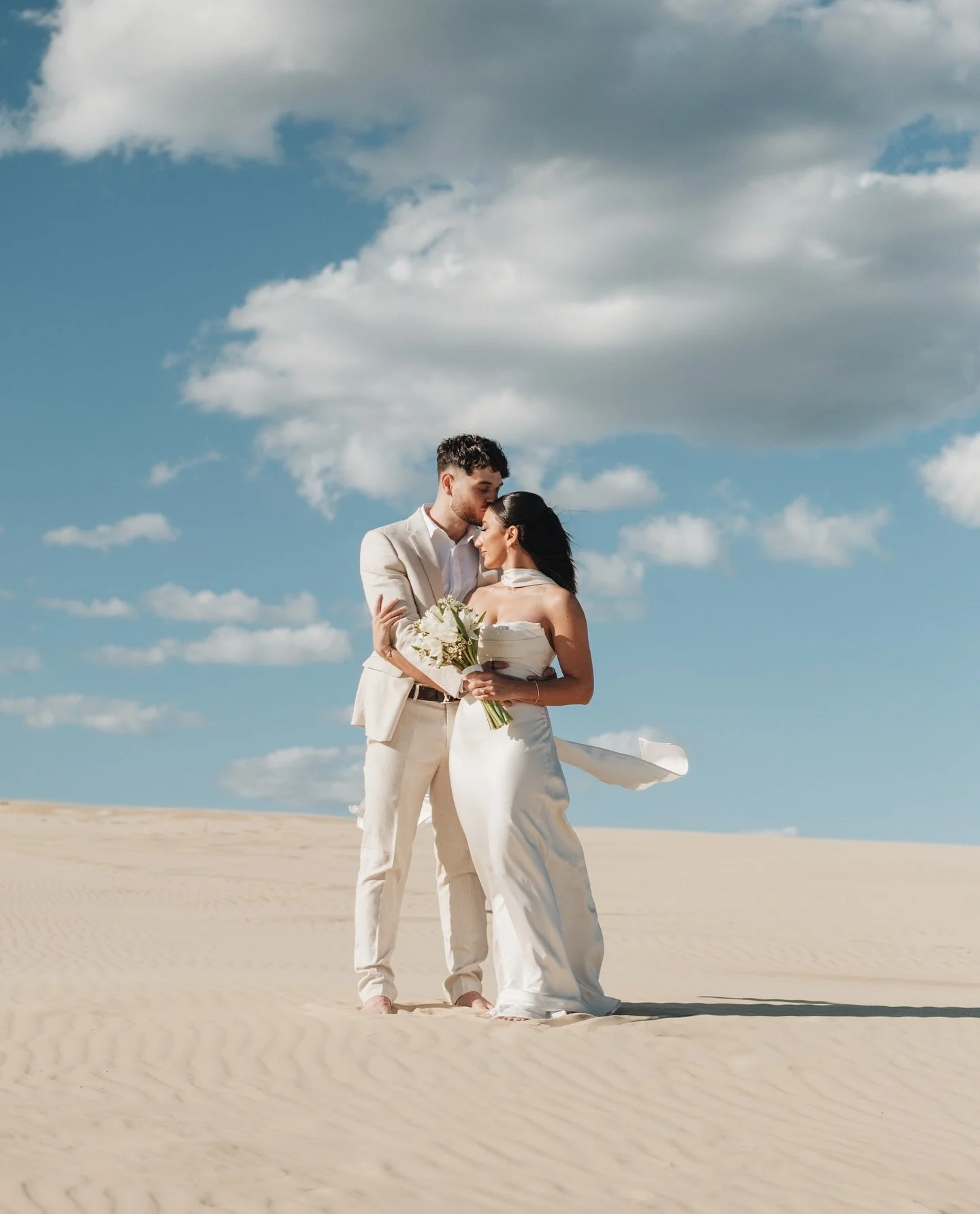 poetic, editorial lines &amp; ivory sand in slow drift 🤍
sydney pre-wedding &bull; stockton sand dunes, anna bay

mua @narmeenyaqubmakeup 
blooms @_littleprinceflowershop