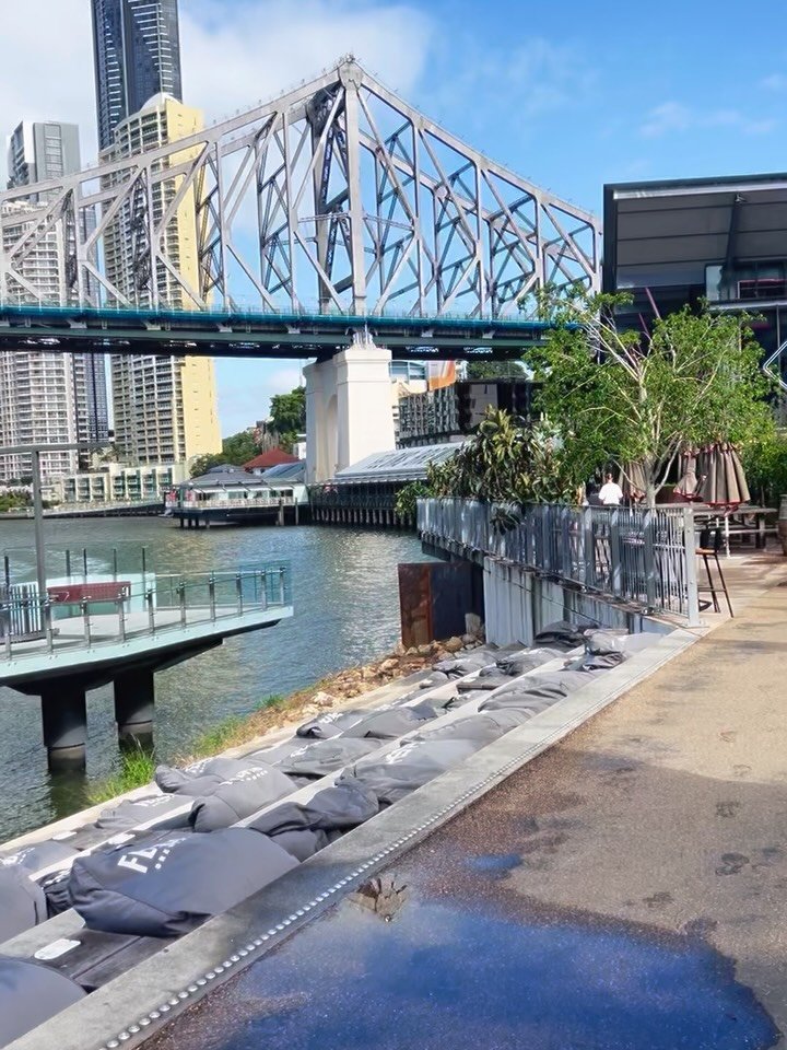 A city built twice.
Once in heavy steel.
Once in fleeting water.
The Story Bridge, suspended in a temporary sky right at our feet.
#brisbane #storybridge #urbanpoetry #visualsilence #stillplaces