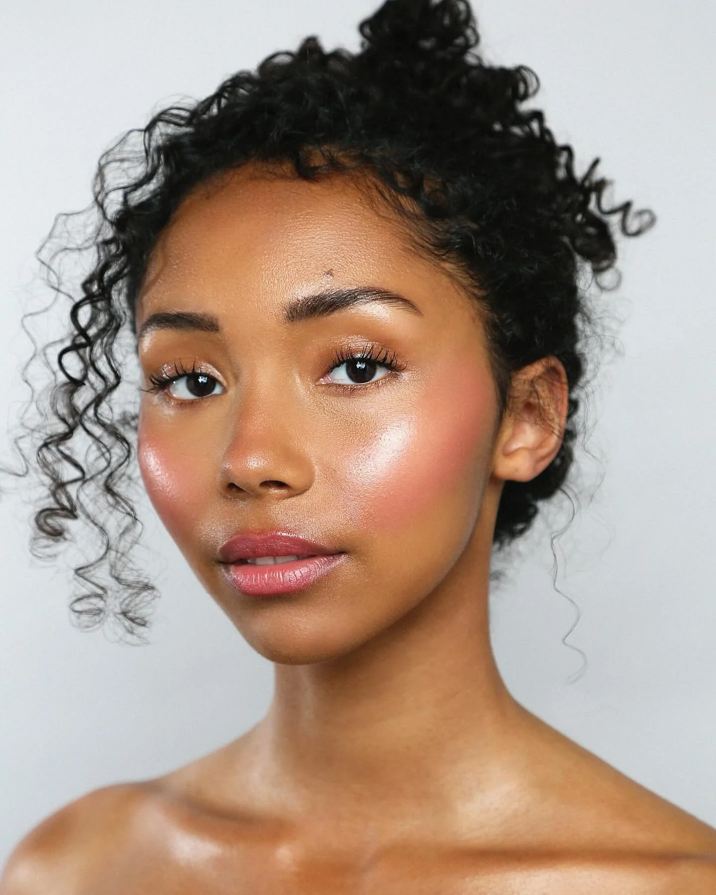 Creating the Ibiza glow is always my favourite. I layer different textures and usually three different cream highlighters and blushers to get that fresh, radiant skin that looks alive in every light. This kind of base is my go-to for shoots, events a