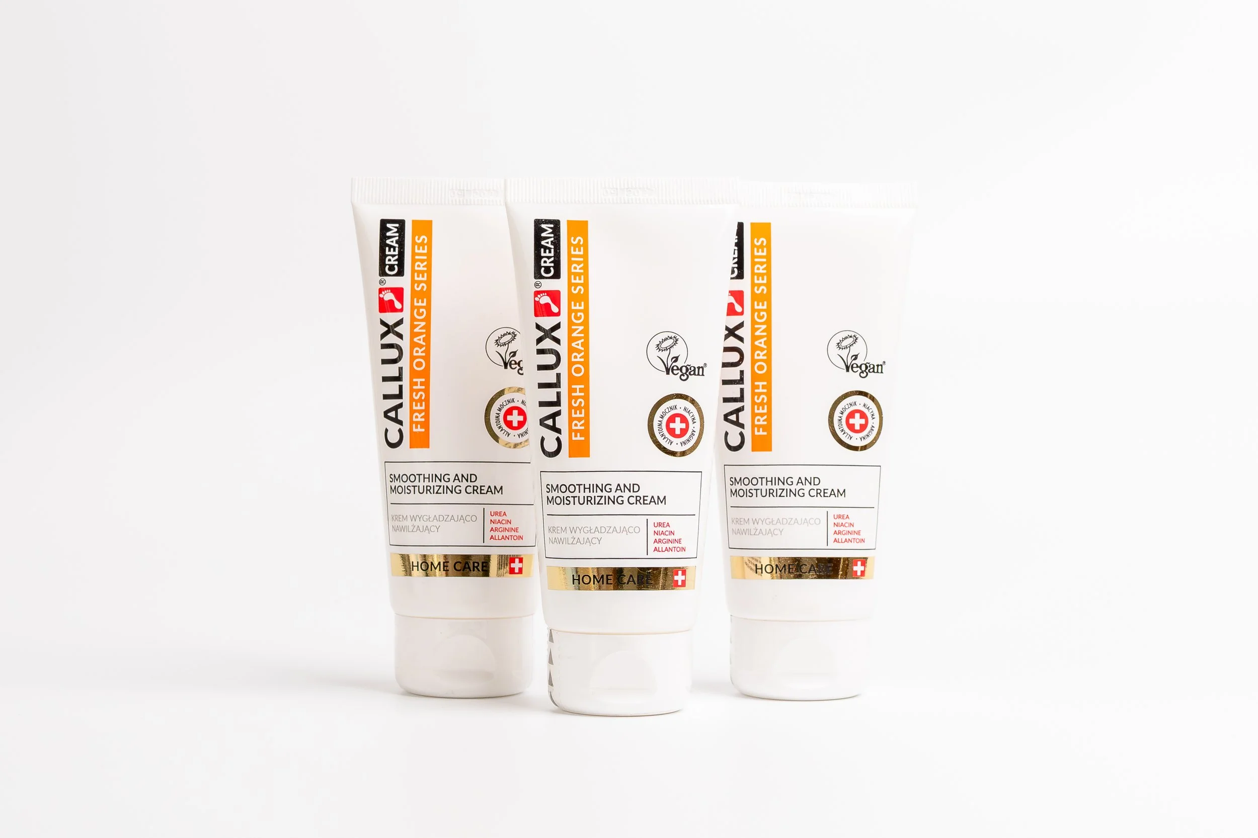 Three tubes of Callux Vegan Fresh Orange Series soothing and moisturizing cream on a white background.