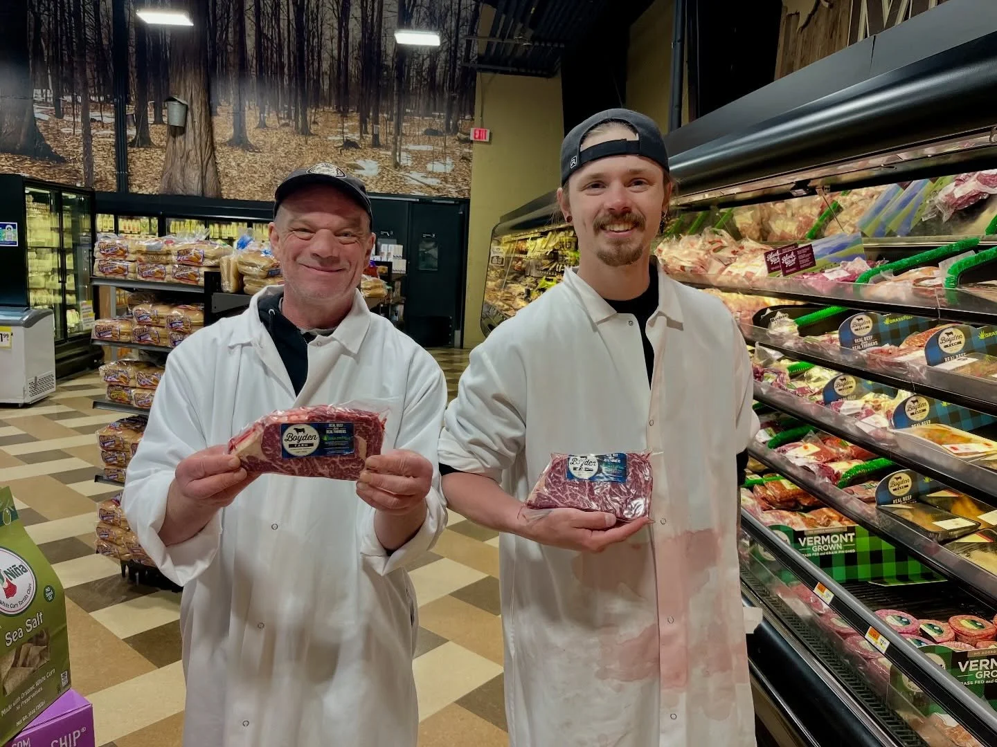 Chris and Corey at Jericho Market showing off one of our beautiful ribeyes. Just look at that marbling!

At Boyden Beef, our GrassPlus program combines the benefits of a grass-based diet with a carefully managed finishing program to produce beef that
