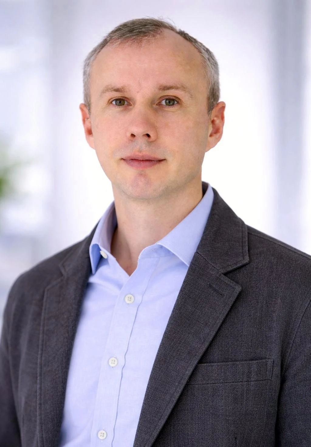 Silhouette of a person's head and shoulders against a dark background.
