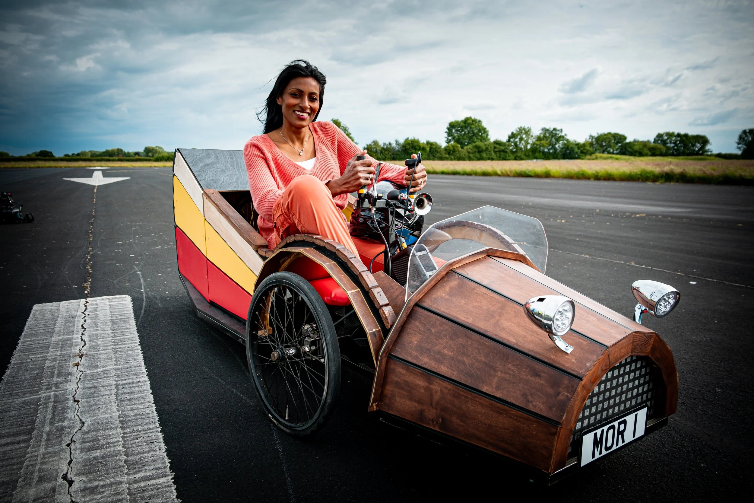 Shini-on-Runway-in-DIY-car-2.jpg