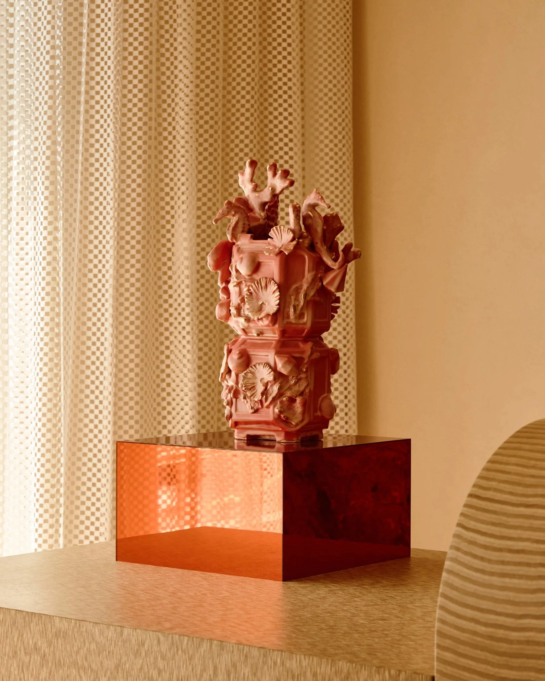 Installation view, Gilded Tropic, 2023, Glazed stoneware with 14k gold luster, and mirrored plexi pedestal, 31 x 16 x 16 inches