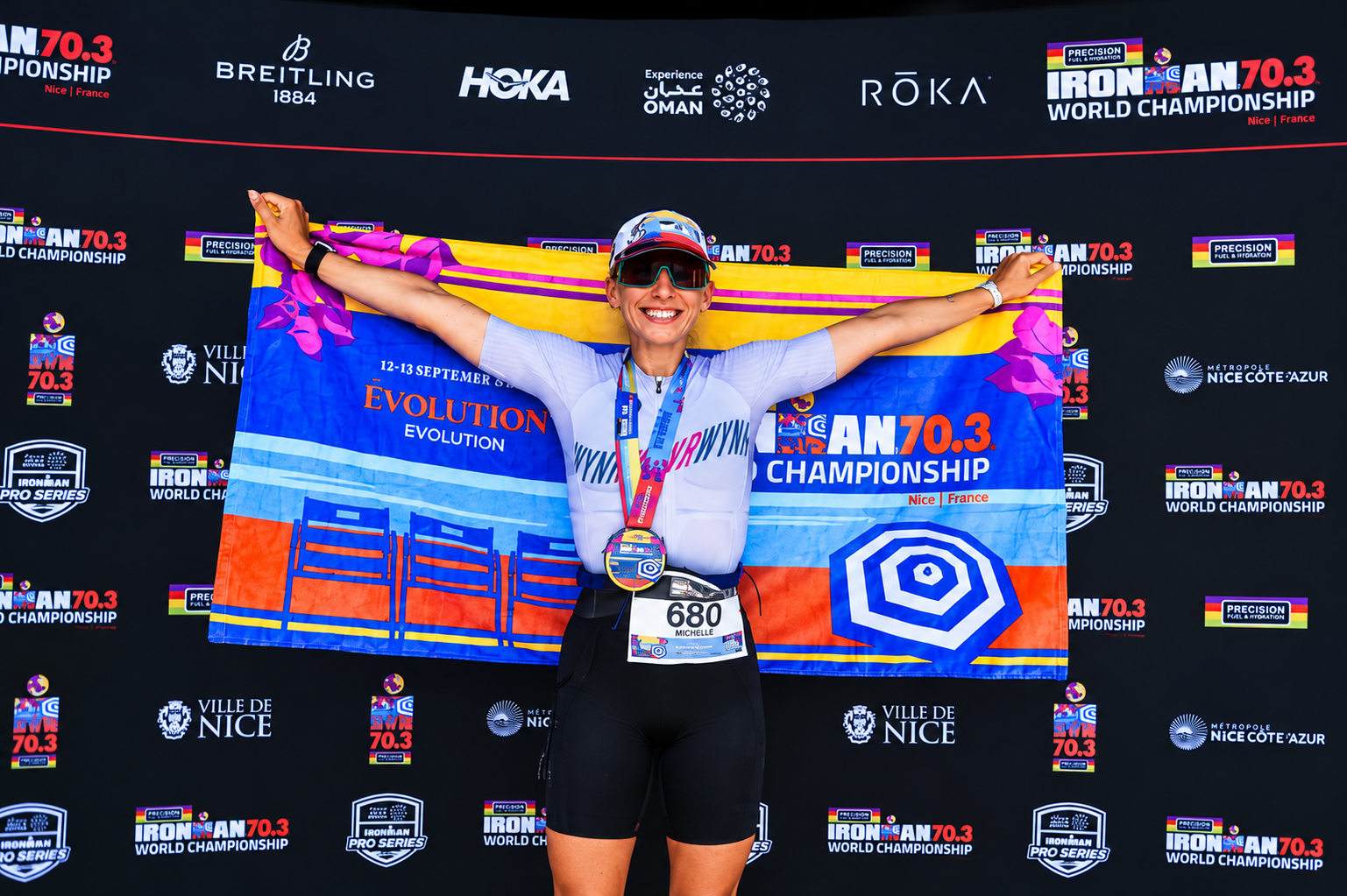 Coach Michelle Carr at the Ironman 70.3 World Championship, celebrating her endurance racing achievement.