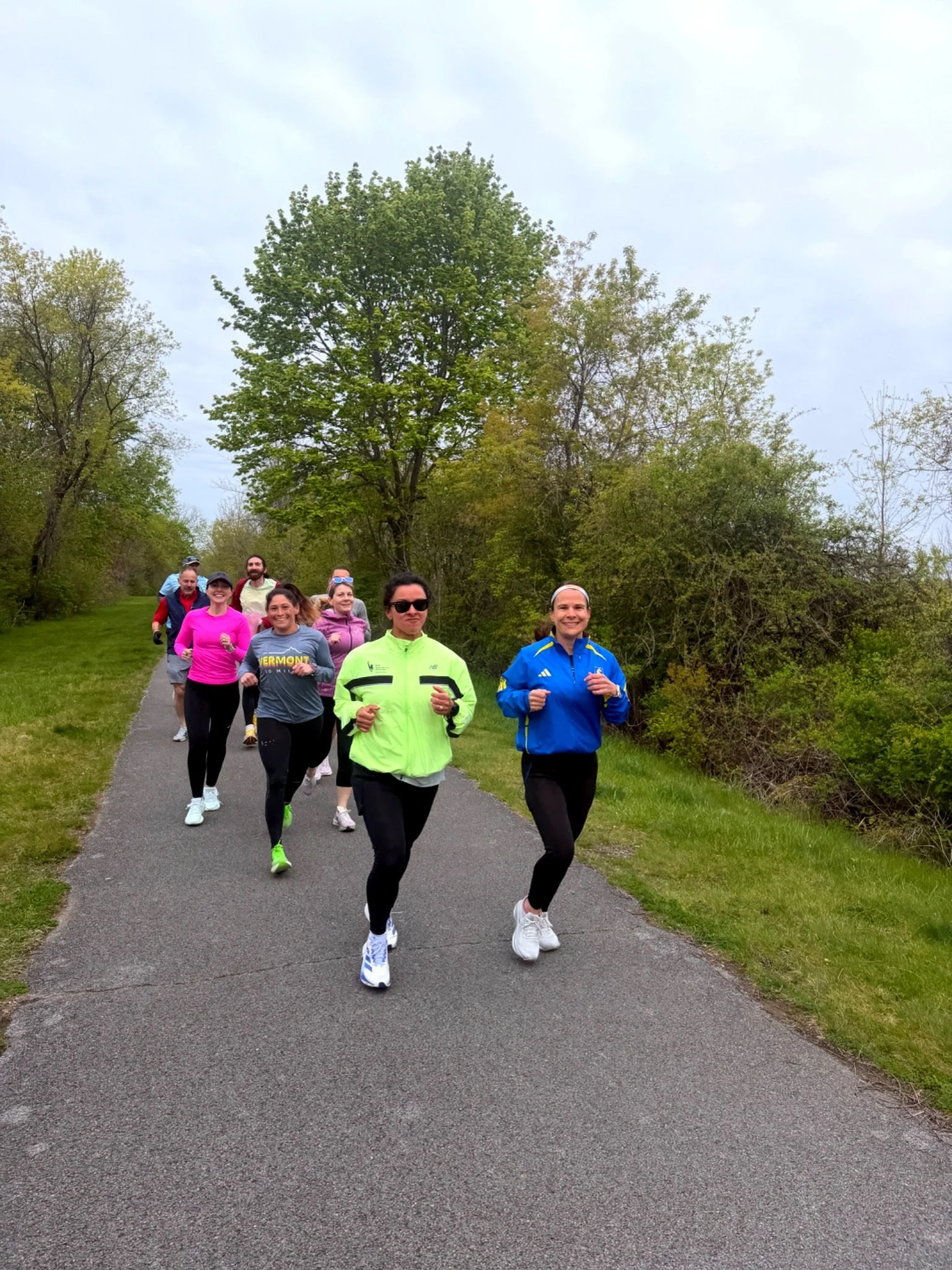 Empire State Endurance athletes running together on a Capital Region trail.