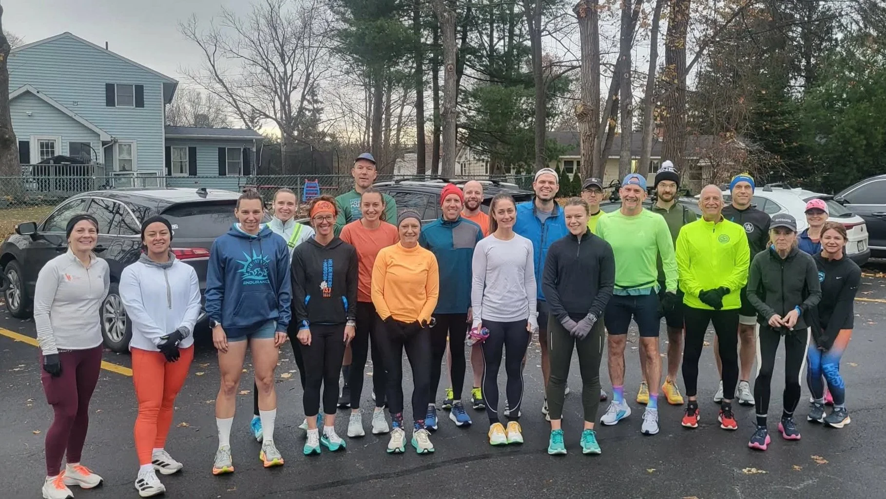 Group of runners gathered outside before a group long run.