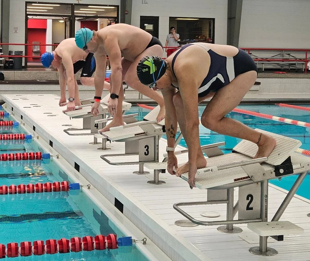 Adult swimmers receiving swim meet instruction from the RPI Swim Team during an Empire State Endurance and Adirondack Masters Swimming clinic.
