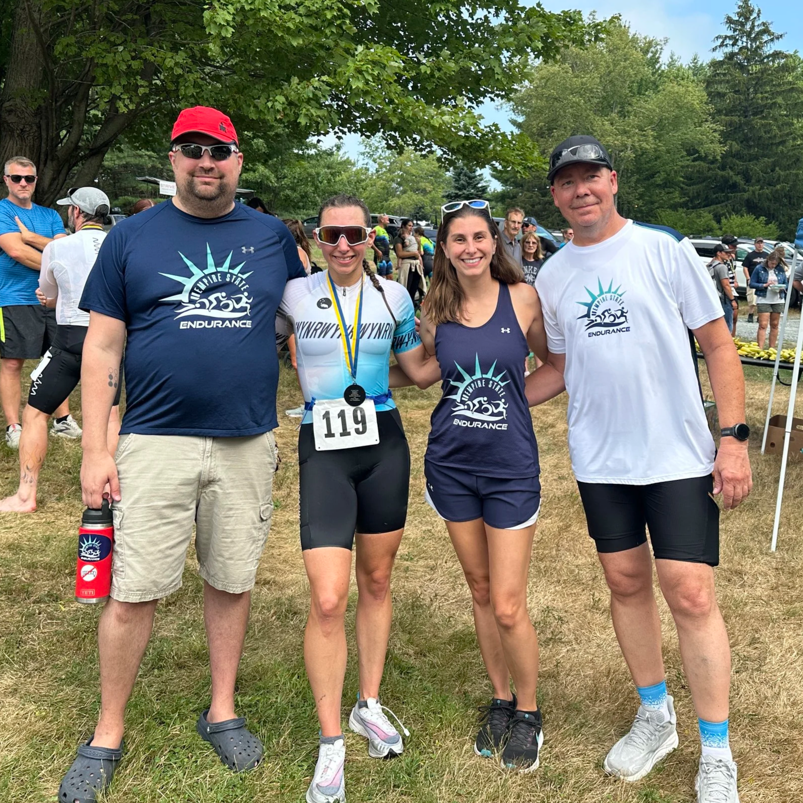 Coaching team from Empire State Endurance gathered outside after the Crystal Lake Triathlon