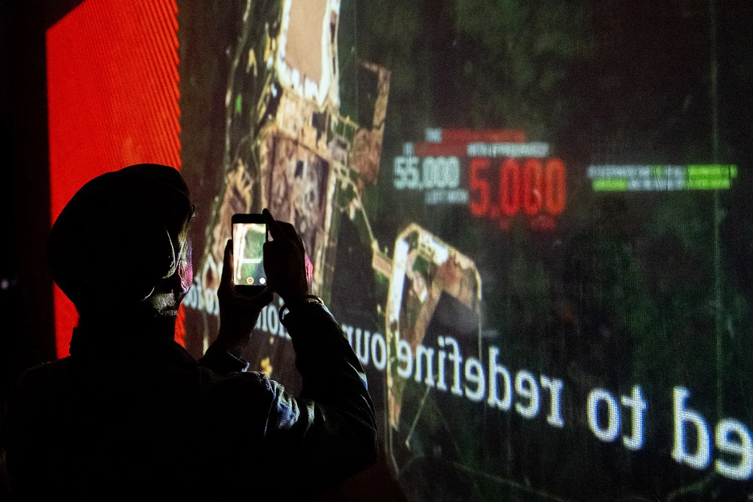 Unposed, real moments that reflect the audience engagement - an onlooker photographing D-fuse video arrt installation.